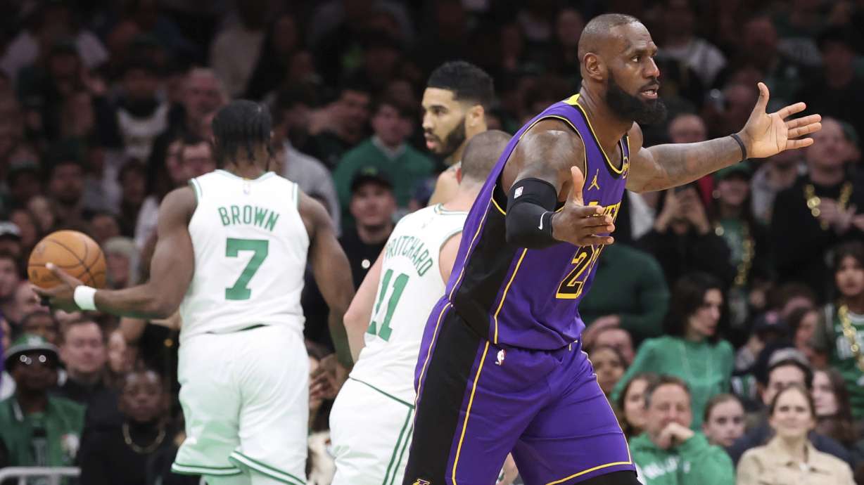 Los Angeles Lakers forward LeBron James, right, reacts after a foul was called during the second half of an NBA basketball game against the Boston Celtics, Saturday, March 8, 2025, in Boston.