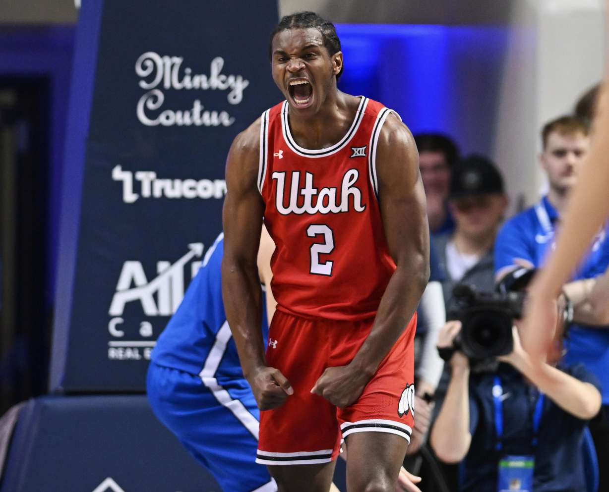 Utah Utes forward Ezra Ausar (2) screams after dunking the ball as BYU and Utah play at the Marriott Center in Provo on Saturday, March 8, 2025.