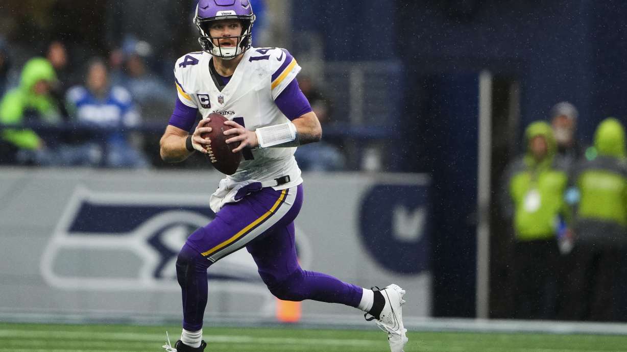 FILE - Minnesota Vikings quarterback Sam Darnold looks to pass during an NFL football game against the Seattle Seahawks, Sunday, Dec. 22, 2024, in Seattle.