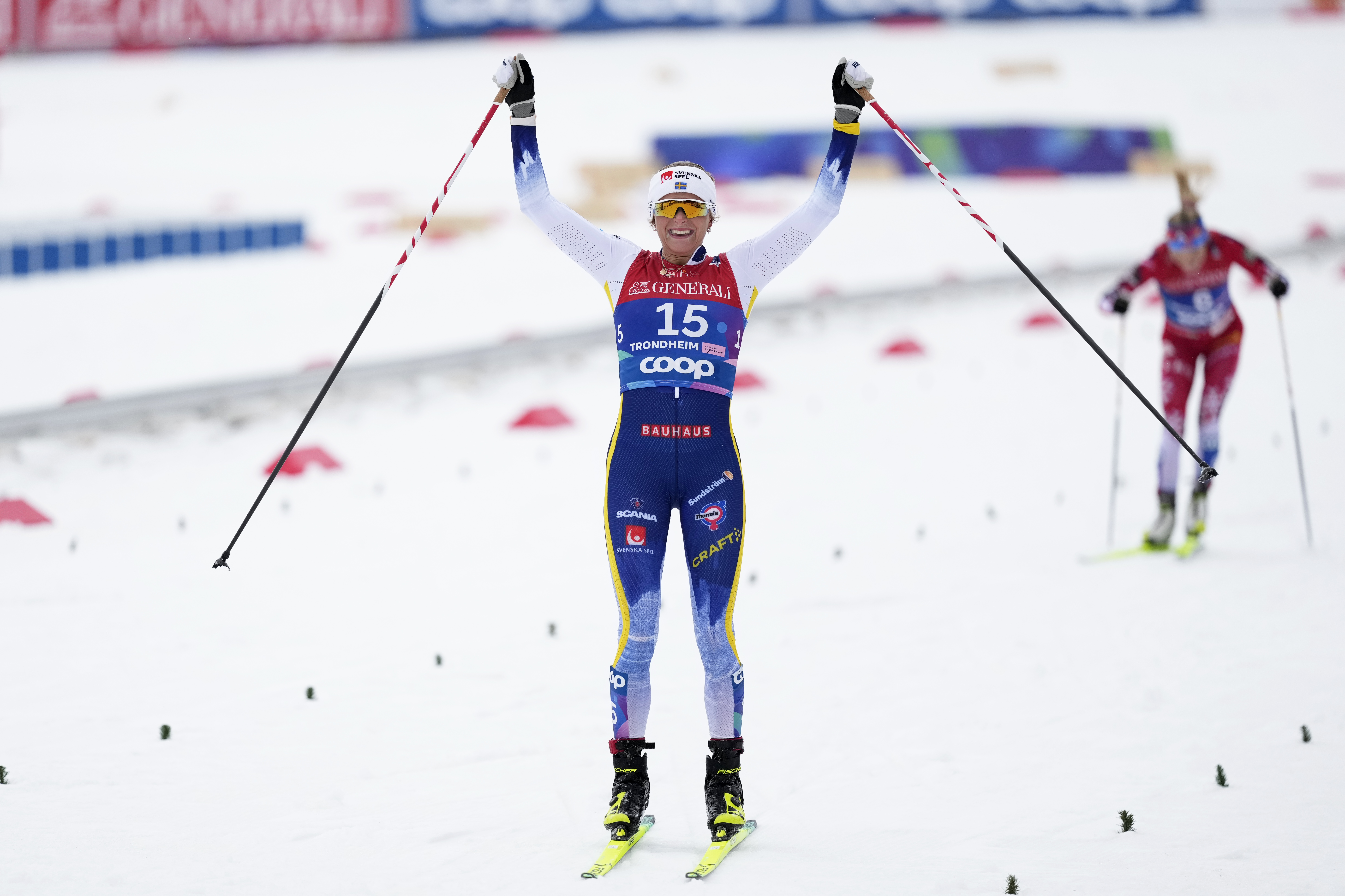 Frida Karlsson, of Sweden, crosses the finish line to win the gold medal in the cross-country women's mass start 50 Km at the Nordic World Ski Championships in Trondheim, Norway, Sunday, March 9, 2025. 