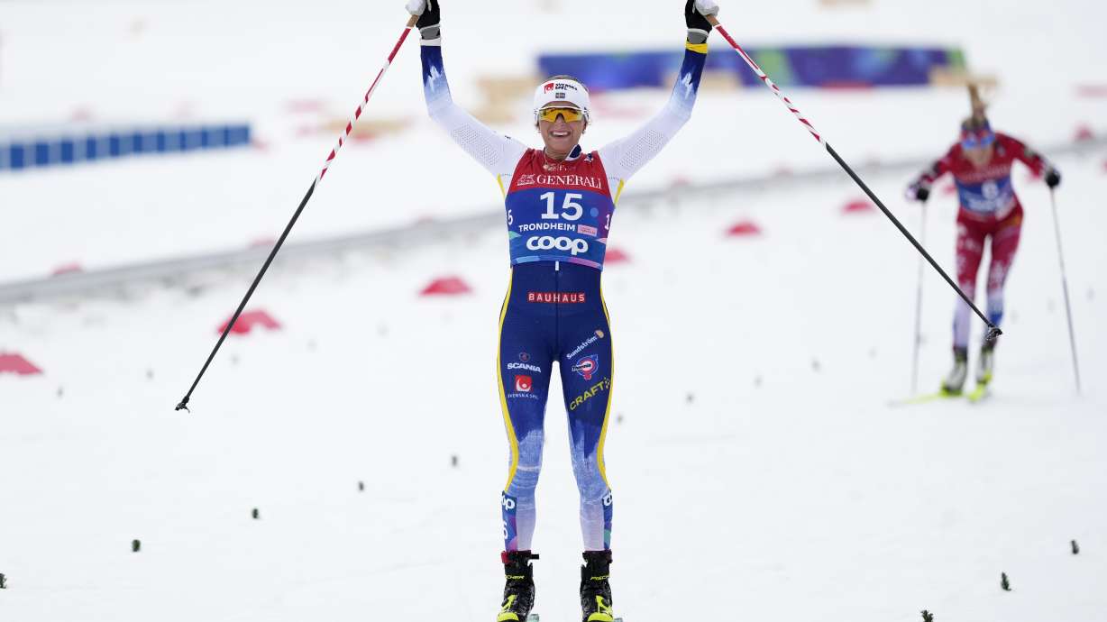 Frida Karlsson, of Sweden, crosses the finish line to win the gold medal in the cross-country women's mass start 50 Km at the Nordic World Ski Championships in Trondheim, Norway, Sunday, March 9, 2025.