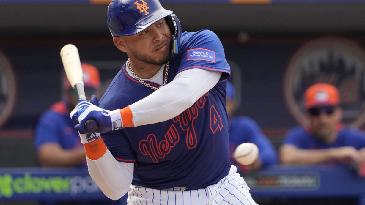 New York Mets' Francisco Alvarez takes a ball during the fourth inning of a spring training baseball game against the Houston Astros Thursday, Feb. 27, 2025, in Port St. Lucie, Fla.