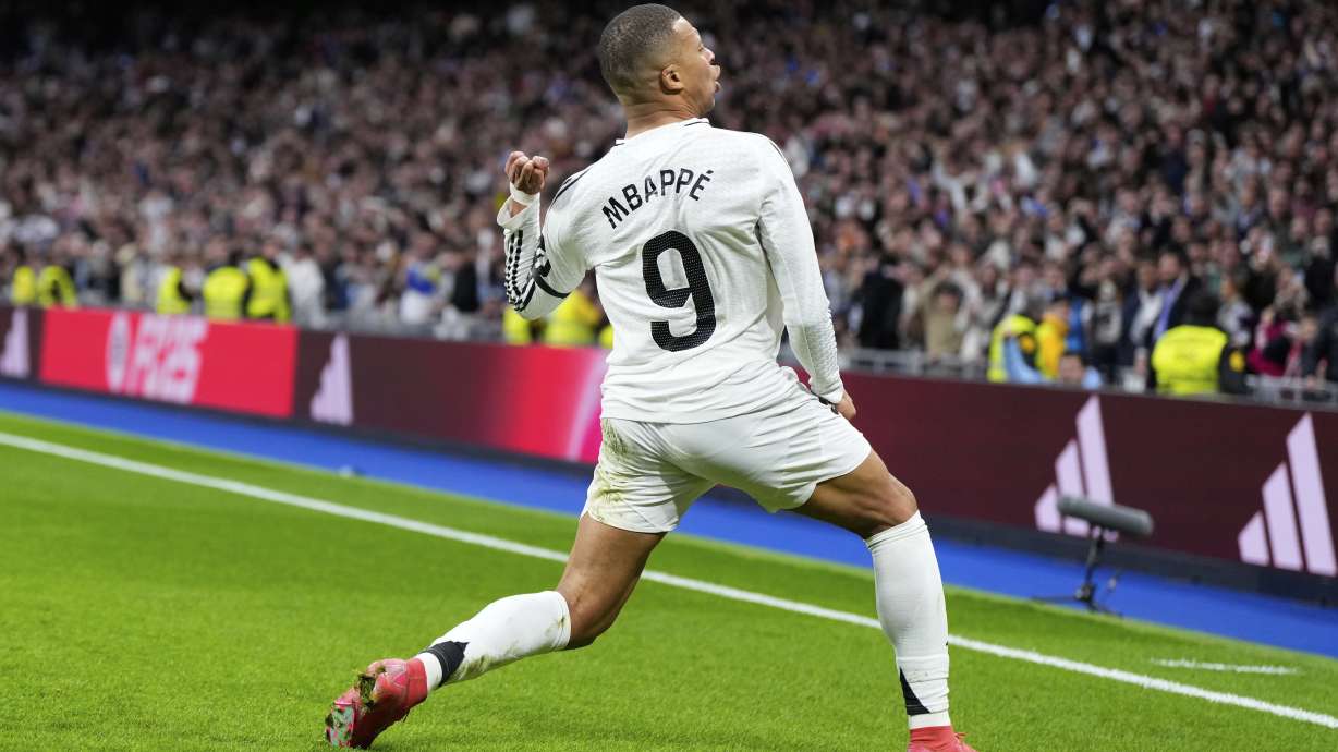 Real Madrid's Kylian Mbappe celebrates after scoring his side's opening goal during the Spanish La Liga soccer match between Real Madrid and Rayo Vallecano at the Santiago Bernabeu stadium in Madrid, Spain, Sunday, March 9, 2025.