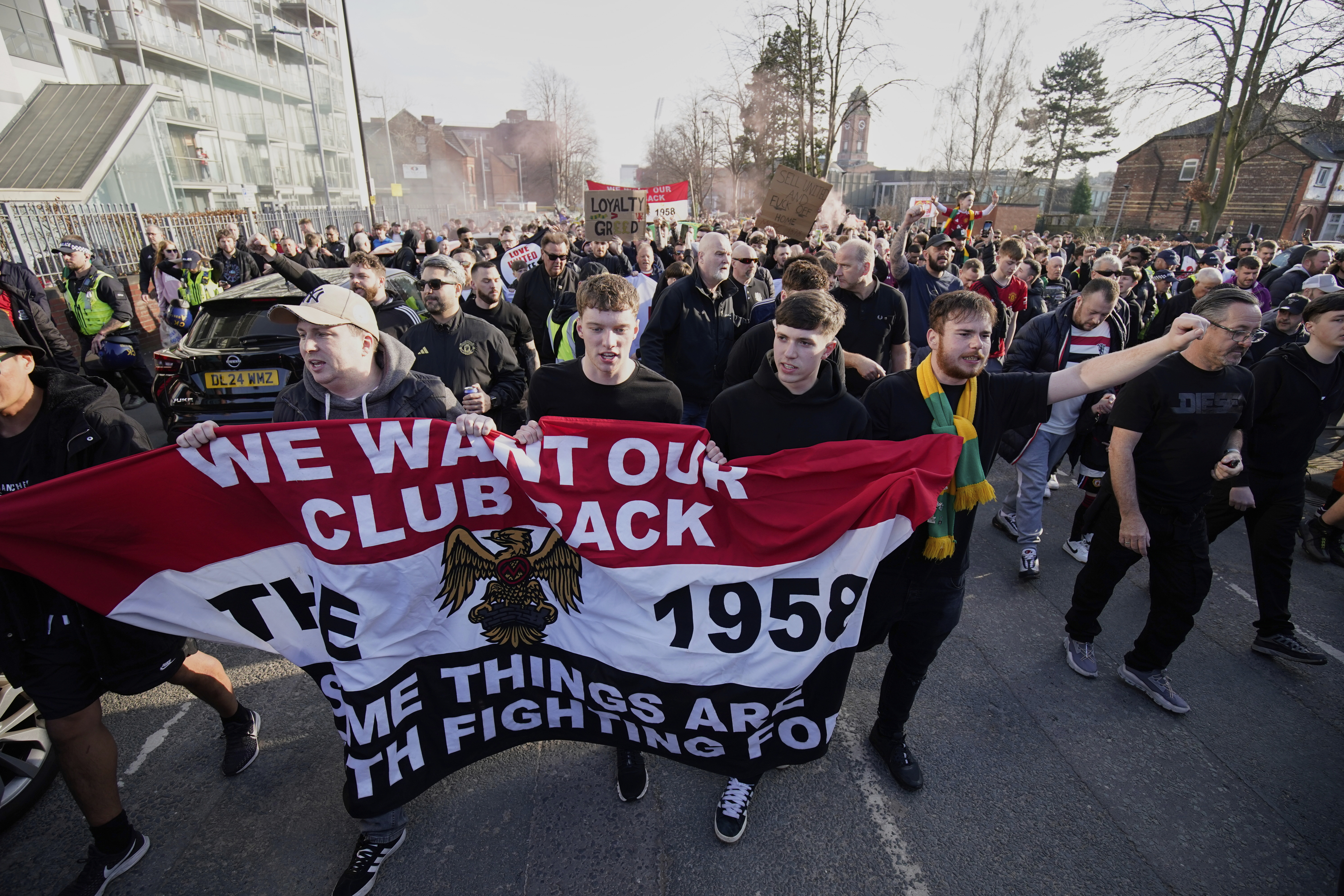 Manchester United fans protest against the club's owners, the Glazer family, prior to the English Premier League soccer match between Manchester United and Arsenal at Old Trafford stadium in Manchester, England, Sunday, March 9, 2025.