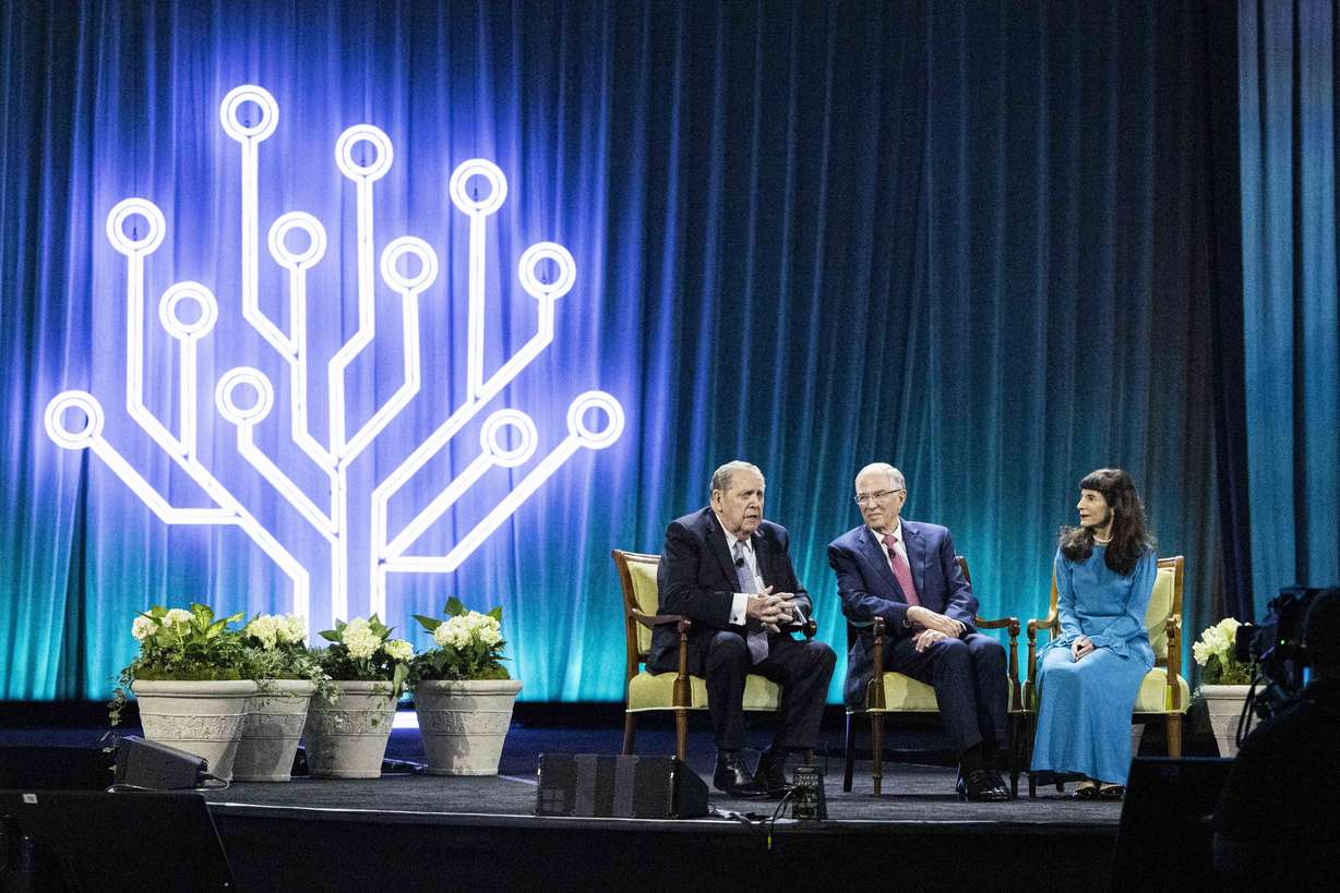 Elder Jeffrey R. Holland, Acting President of the Quorum of the Twelve Apostles of The Church of Jesus Christ of Latter-day Saints, speaks as he’s joined by Elder Neil L. Andersen, a member of the Quorum of the Twelve Apostles, and Andersen’s wife, Sister Kathy Andersen, during the final day of RootsTech 2025 held at the Salt Palace Convention Center in Salt Lake City on Saturday.