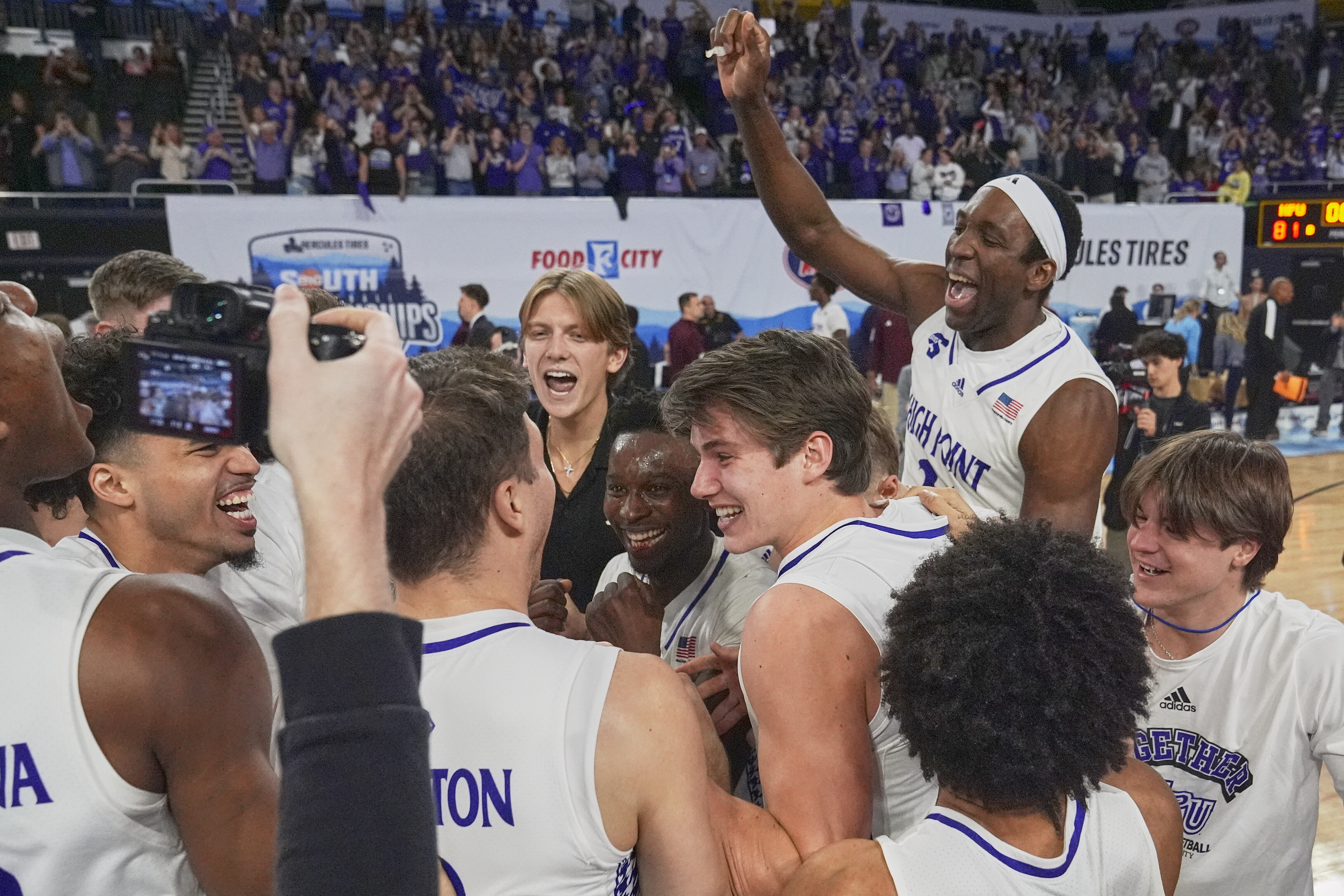 High Point players celebrate on the court after winning the Big South Championship NCAA college basketball game against Winthrop, Sunday, March 9, 2025, in Johnson City, Tenn. 