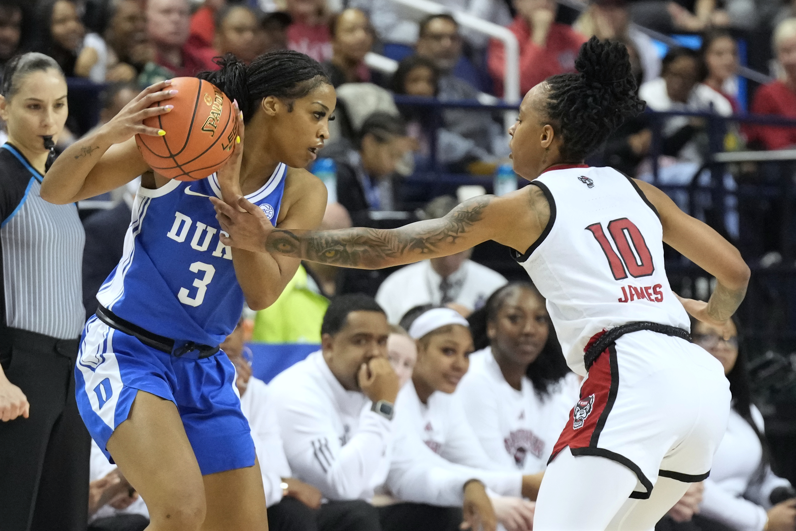 NC State guard Aziaha James (10) guards Duke guard Ashlon Jackson (3) during an NCAA college basketball game in the championship of the Atlantic Coast Conference tournament Greensboro, N.C., Sunday, March 9, 2025.