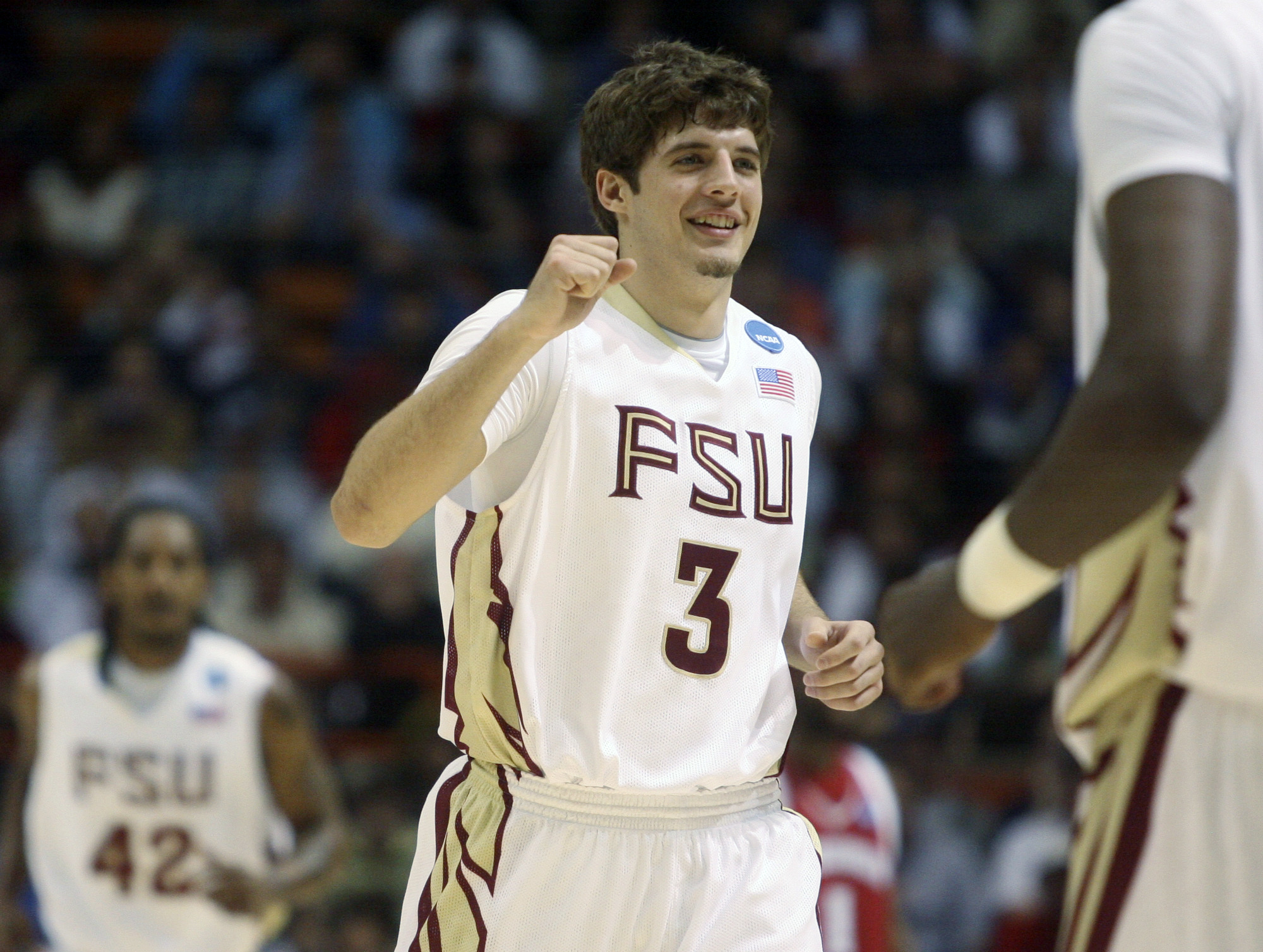FILE - Florida State's Luke Loucks celebrates during a timeout against Wisconsin during a first-round NCAA men's college basketball tournament game, March 20, 2009, in Boise, Idaho.