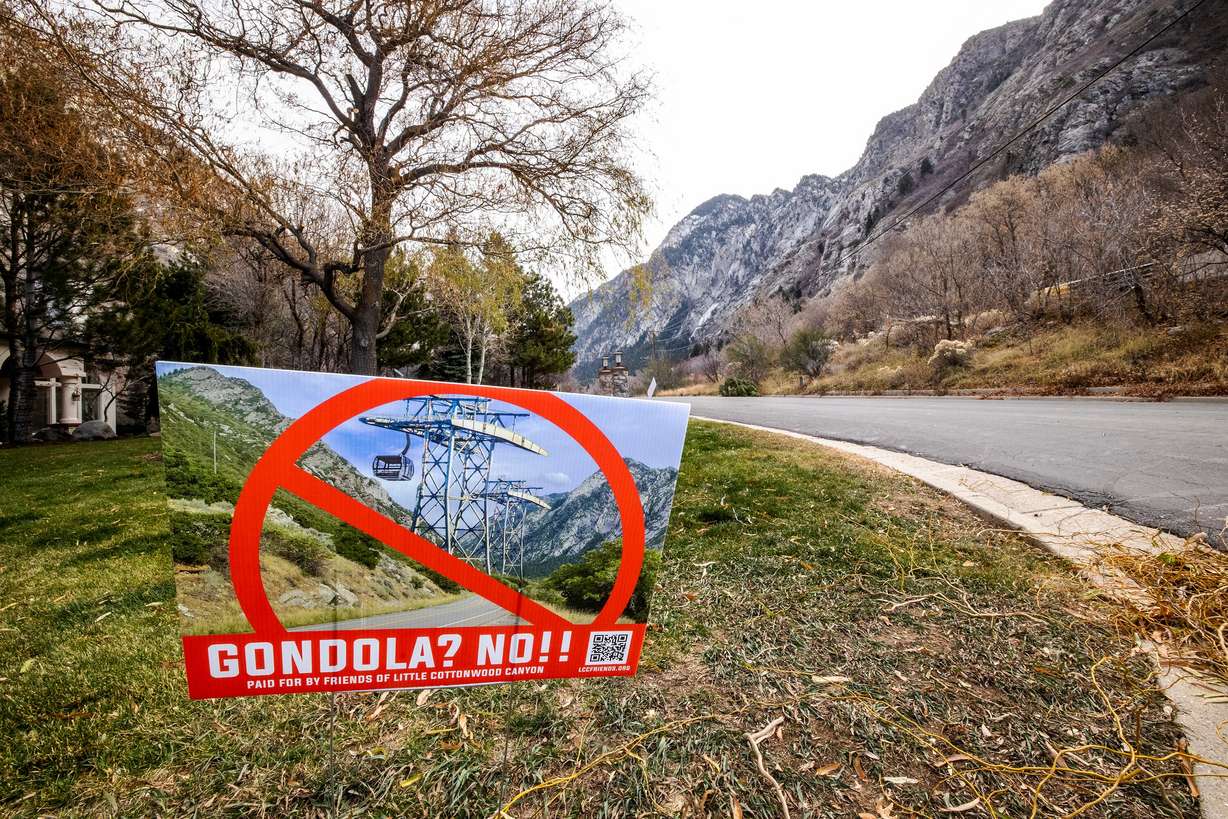 A sign opposed to a gondola is pictured in a yard near the mouth of Little Cottonwood Canyon in Cottonwood Heights on Dec. 7, 2021.