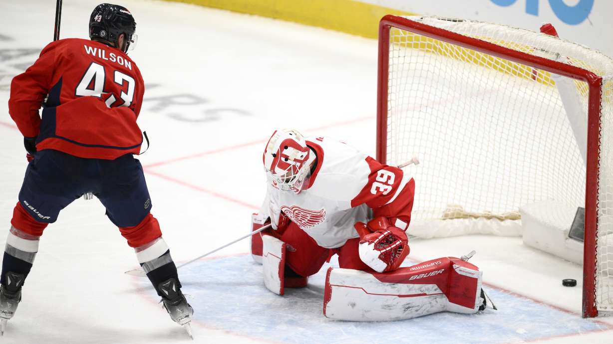 Washington Capitals right wing Tom Wilson (43) scores past Detroit Red Wings goaltender Cam Talbot (39) during the third period of an NHL hockey game, Friday, March 7, 2025, in Washington.