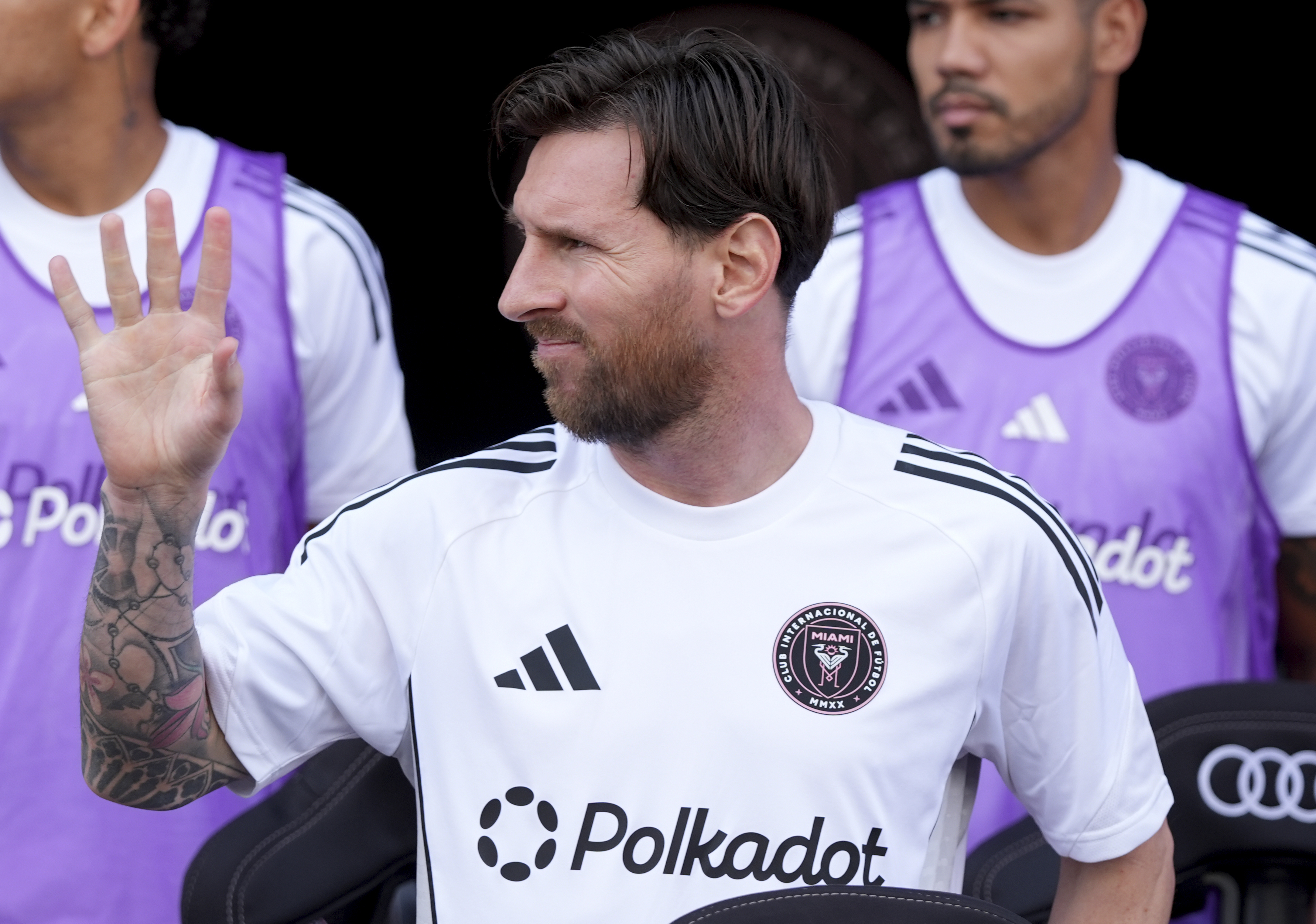 Inter Miami forward Lionel Messi waves from the sideline before an MLS soccer match against Charlotte FC, Sunday, March 9, 2025, in Fort Lauderdale, Fla. 