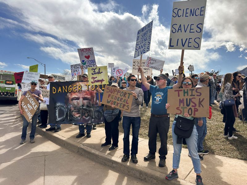 Protesters gather outside a National Oceanic and Atmospheric Administration building, to decry the Trump administration's layoffs of NOAA workers last week, in Boulder, Colo., March 3. NOAA is planning another round of mass layoffs, a person familiar with the plan said on Sunday.