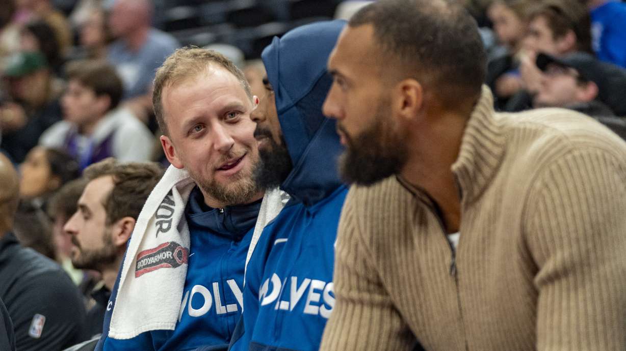 From left, Minnesota Timberwolves guards Joe Ingles, Mike Conley, and center Rudy Gobert sit together on the bench during the second half of an NBA basketball game against the Utah Jazz, Friday, Feb. 28, 2025, in Salt Lake City.