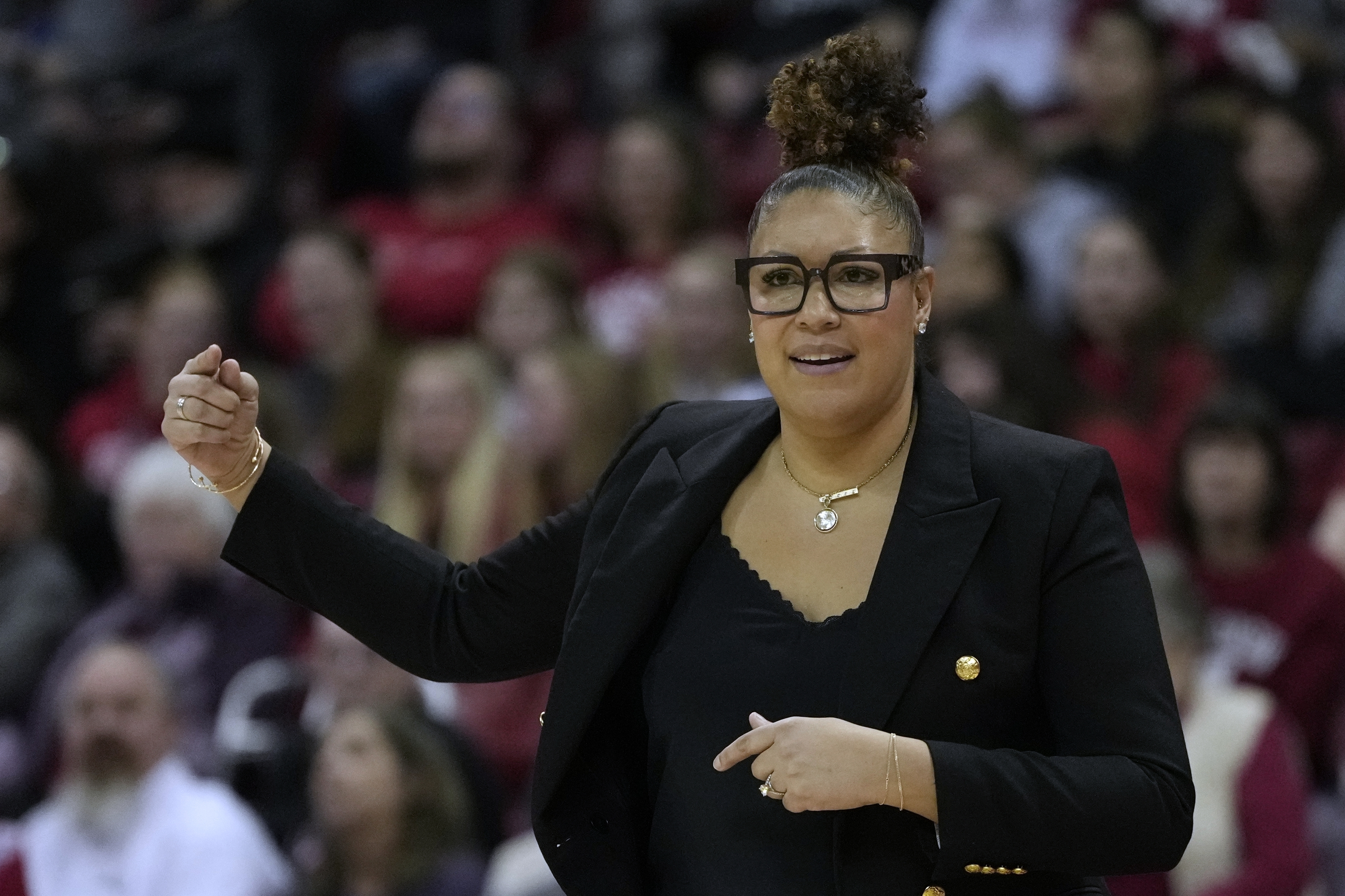 FILE - Wisconsin head coach Marisa Moseley reacts during the first half of an NCAA college basketball game against UCLA, on Feb. 26, 2025, in Madison, Wis. 