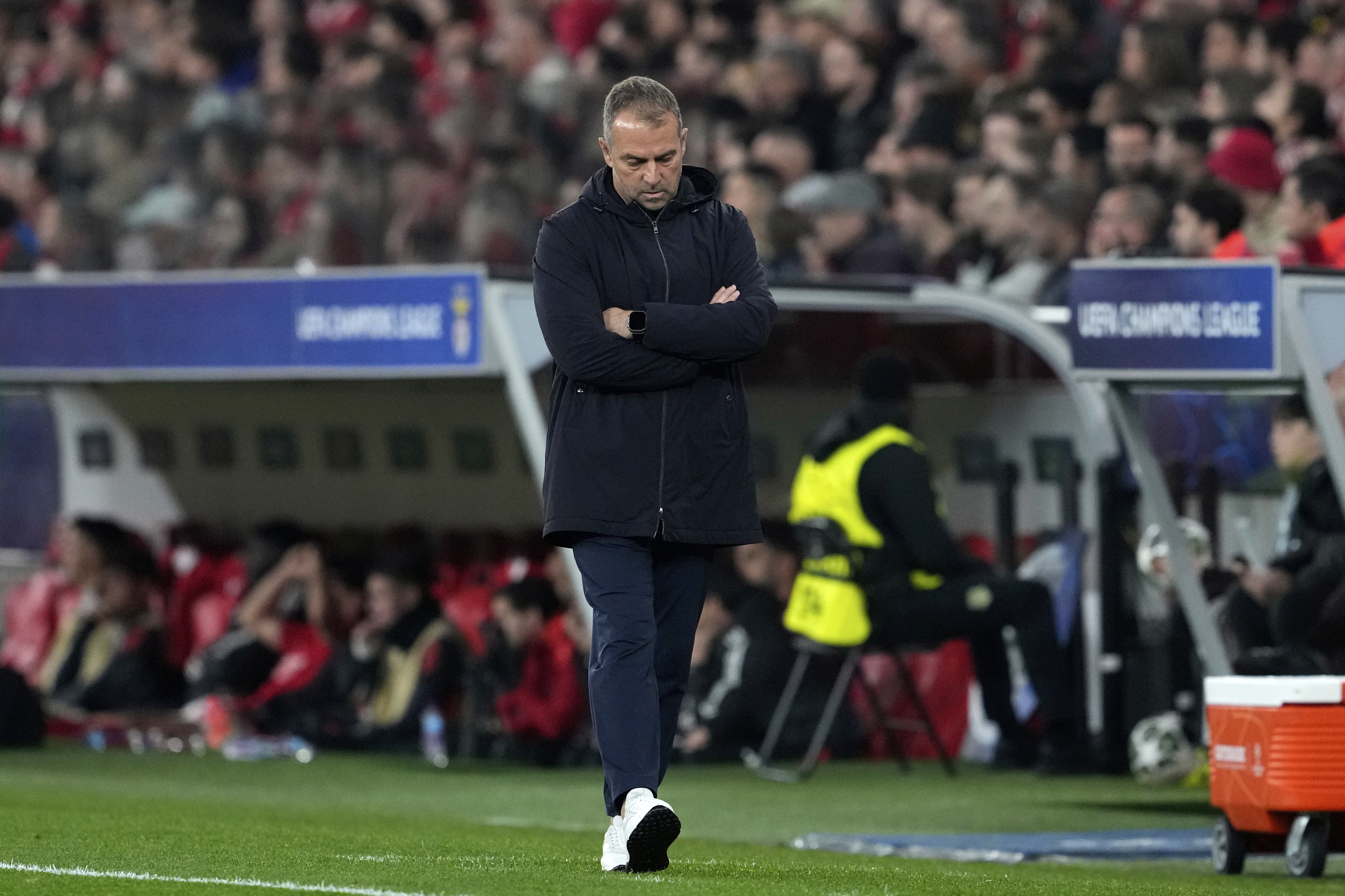Barcelona's head coach Hansi Flick gestures during the Champions League round of 16 first leg soccer match between SL Benfica and FC Barcelona at the Luz stadium in Lisbon, Wednesday, March 5, 2025.