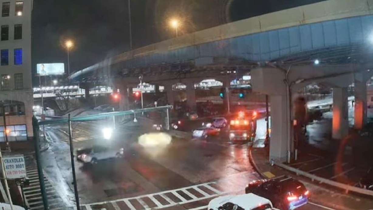 A manhole erupts in smoke at this Worcester, Mass., intersection Jan. 11.