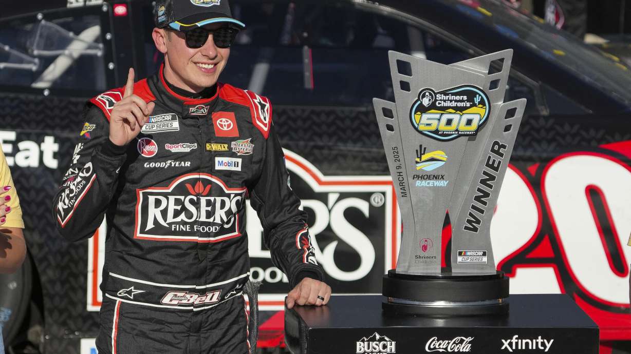Christopher Bell celebrates after winning a NASCAR Cup Series auto race at Phoenix Raceway, Sunday, March 9, 2025, in Avondale, Ariz.