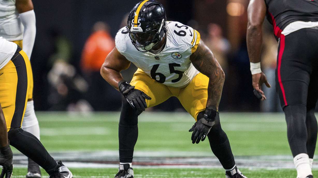 FILE - Pittsburgh Steelers offensive tackle Dan Moore Jr. (65) lines up during the first half of an NFL football game against the Atlanta Falcons, Sept. 8, 2024, in Atlanta.