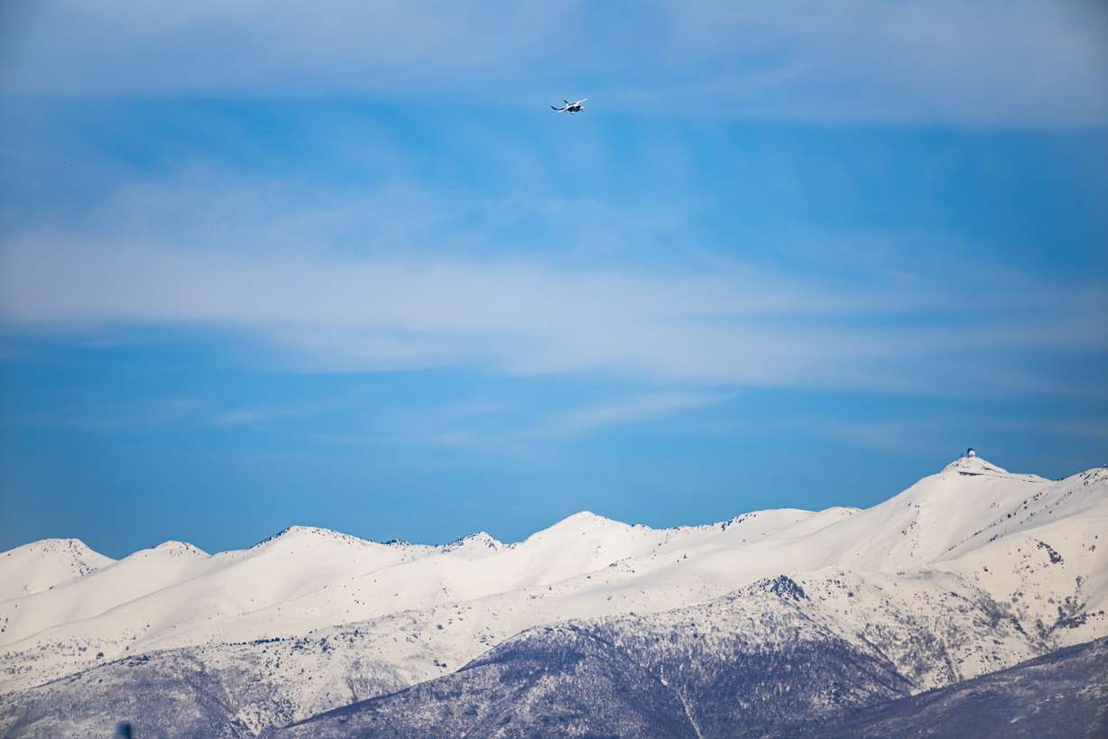 Aerospace company BETA Technologies conducts a flight demonstration of its electric aircraft, ALIA, top center, to showcase the future of air mobility in Utah, at Atlantic Aviation in Salt Lake City on Monday.