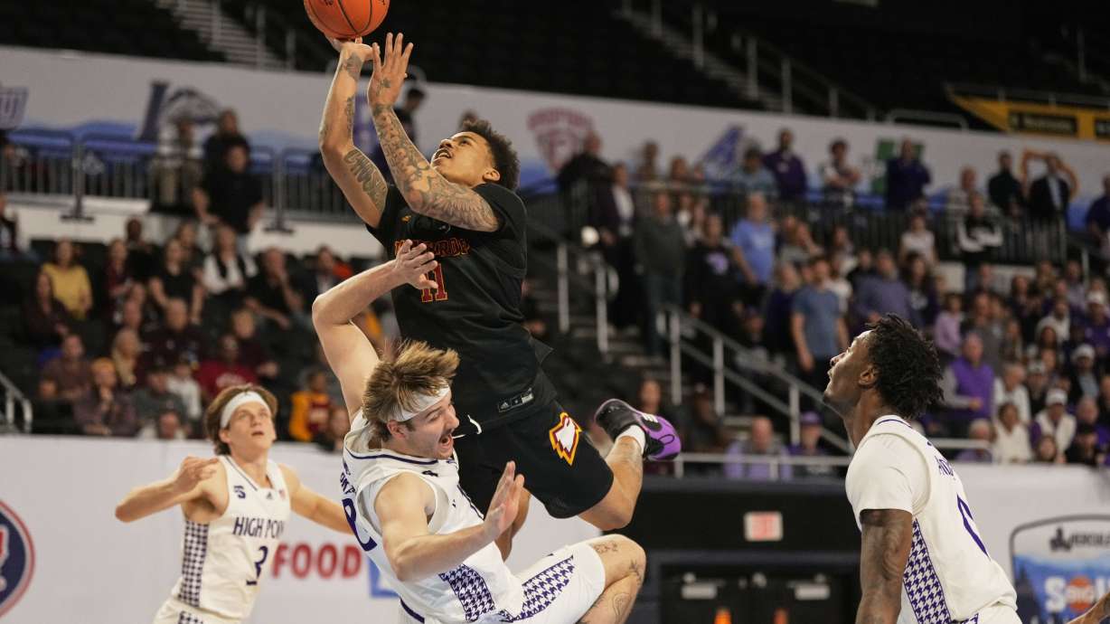 Winthrop guard Kasen Harrison (11) shoots the ball over High Point forward Simon Hildebrandt (10) during the second half of the Big South Championship NCAA college basketball game Sunday, March 9, 2025, in Johnson City, Tenn.