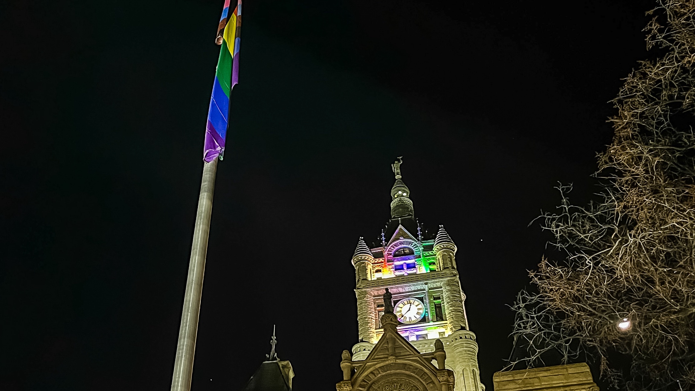 A pride flag flies outside the Salt Lake City and County Building, bathed in rainbow colors, on Friday. HB77, if signed into law, would prohibit the showing of flags in such circumstances.
