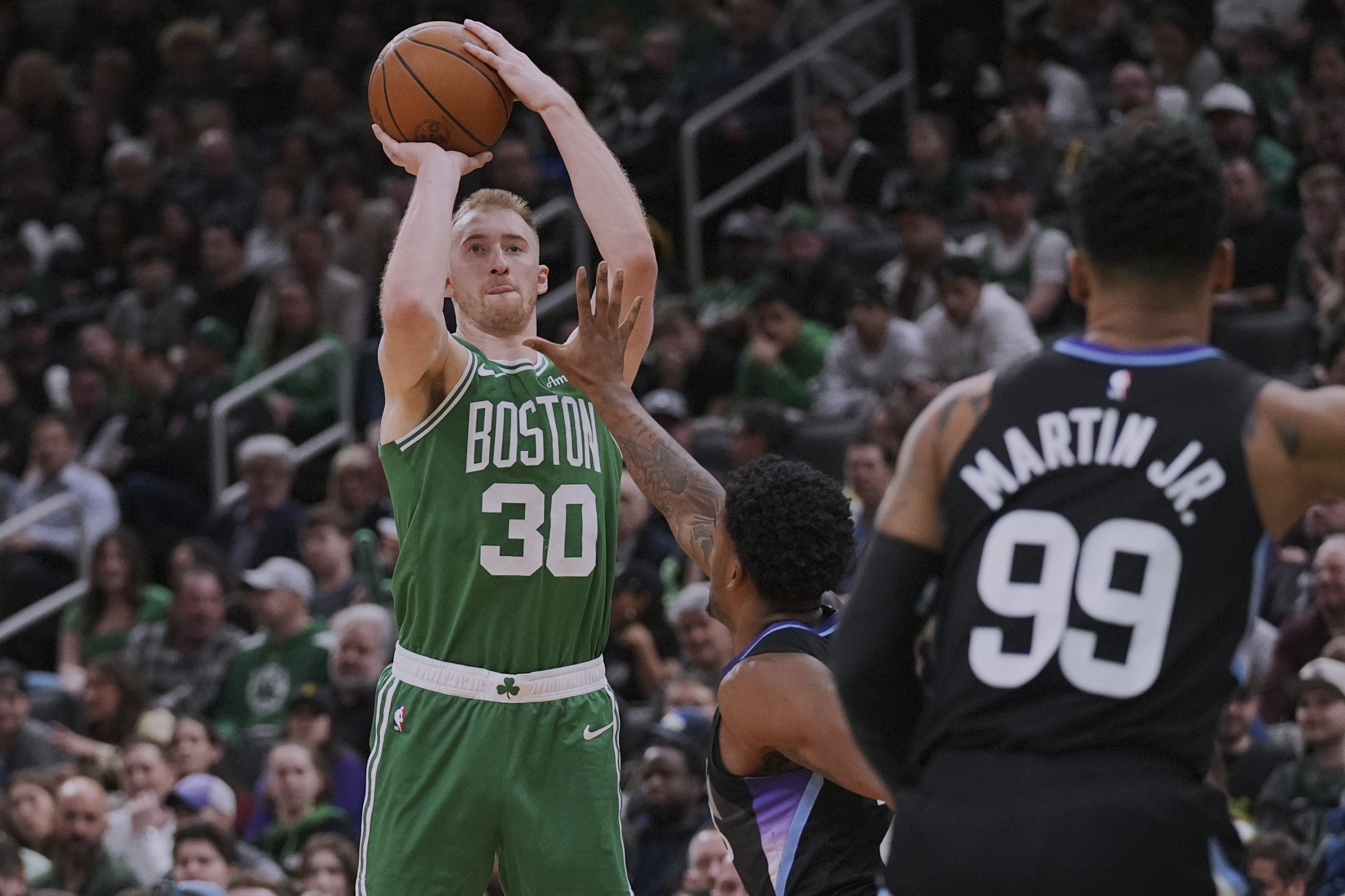 Boston Celtics forward Sam Hauser (30) takes a 3-point shot against the Utah Jazz during the second half of an NBA basketball game, Monday, March 10, 2025, in Boston. 