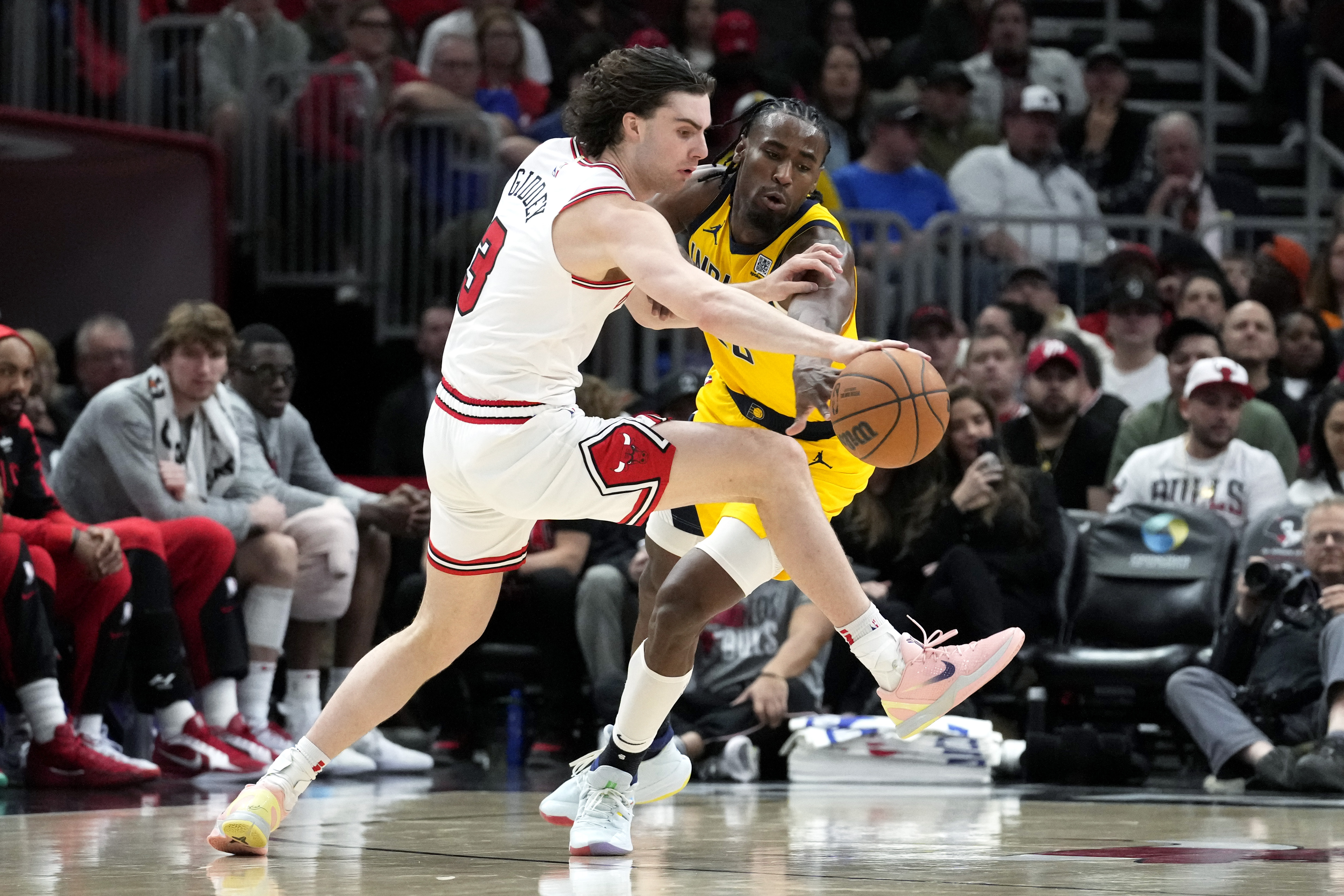 Chicago Bulls guard Josh Giddey, left, drives as Indiana Pacers forward Aaron Nesmith, right, guards during the second half of an NBA basketball game in Chicago, Monday, March 10, 2025.