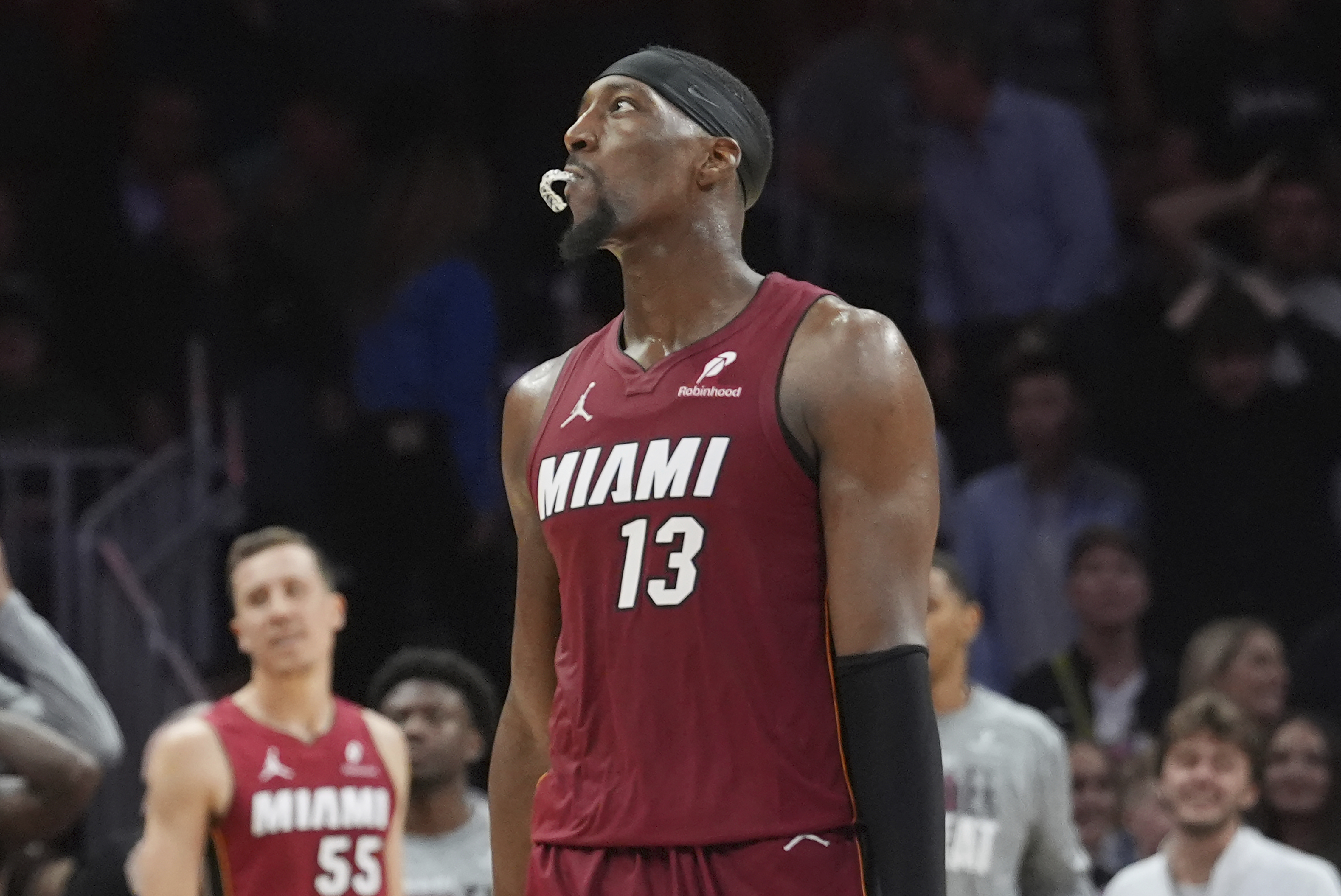 Miami Heat center Bam Adebayo (13) looks up after missing a three-point basket late in the second half of an NBA basketball game against the Charlotte Hornets, Monday, March 10, 2025, in Miami.