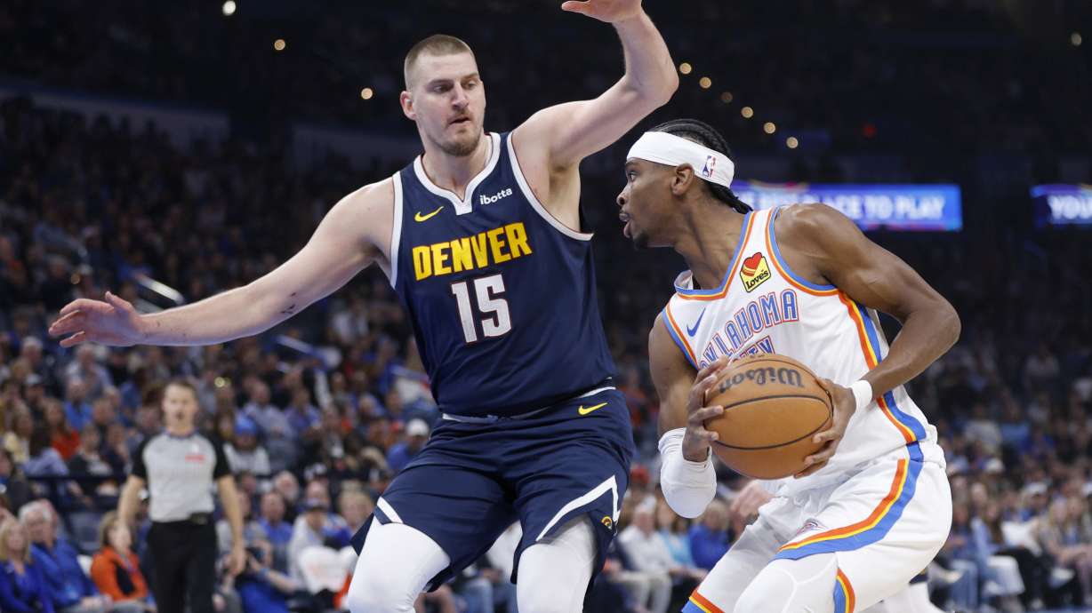 Oklahoma City Thunder guard Shai Gilgeous-Alexander, right, drives against Denver Nuggets center Nikola Jokic (15) during the first half of an NBA basketball game Monday, March 10, 2025, in Oklahoma City.