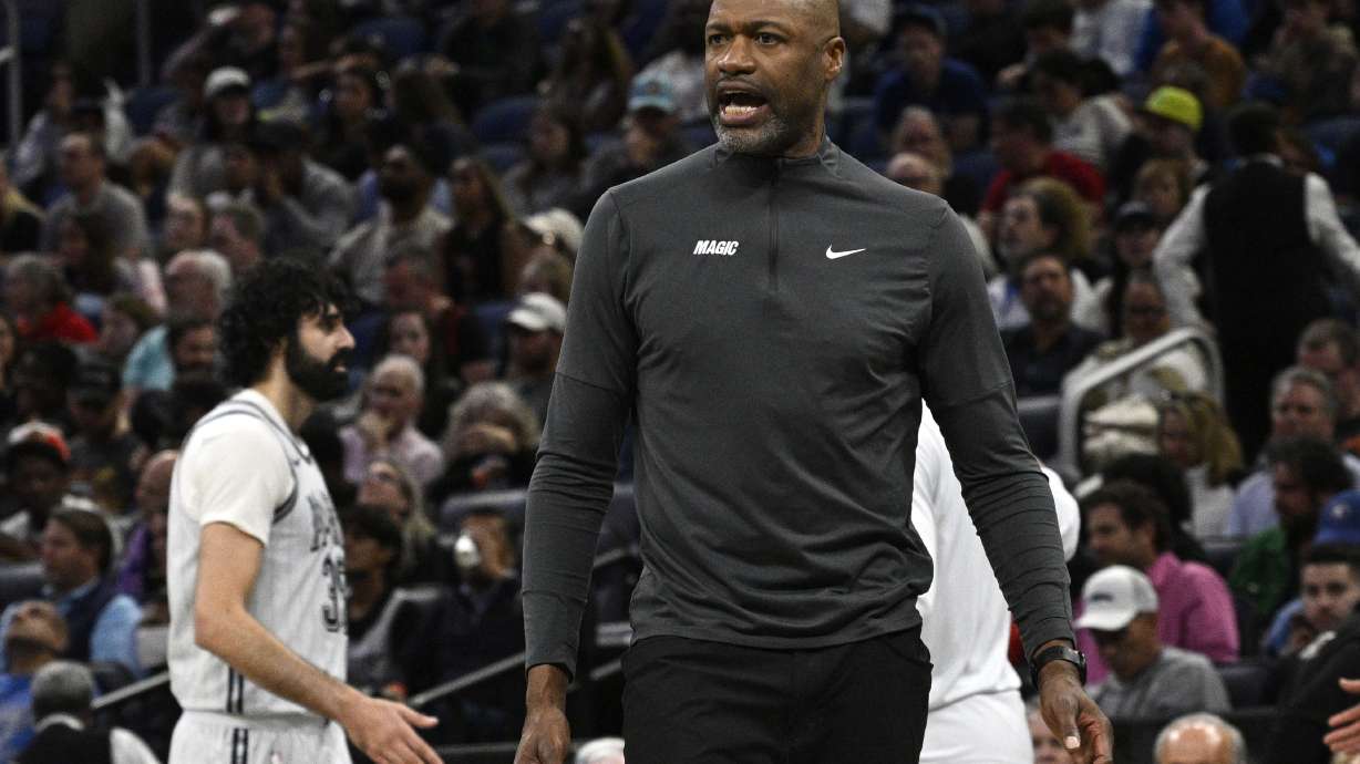 Orlando Magic head coach Jamahl Mosley calls out to an official during the first half of an NBA basketball game against the Toronto Raptors, Tuesday, March 4, 2025, in Orlando, Fla.