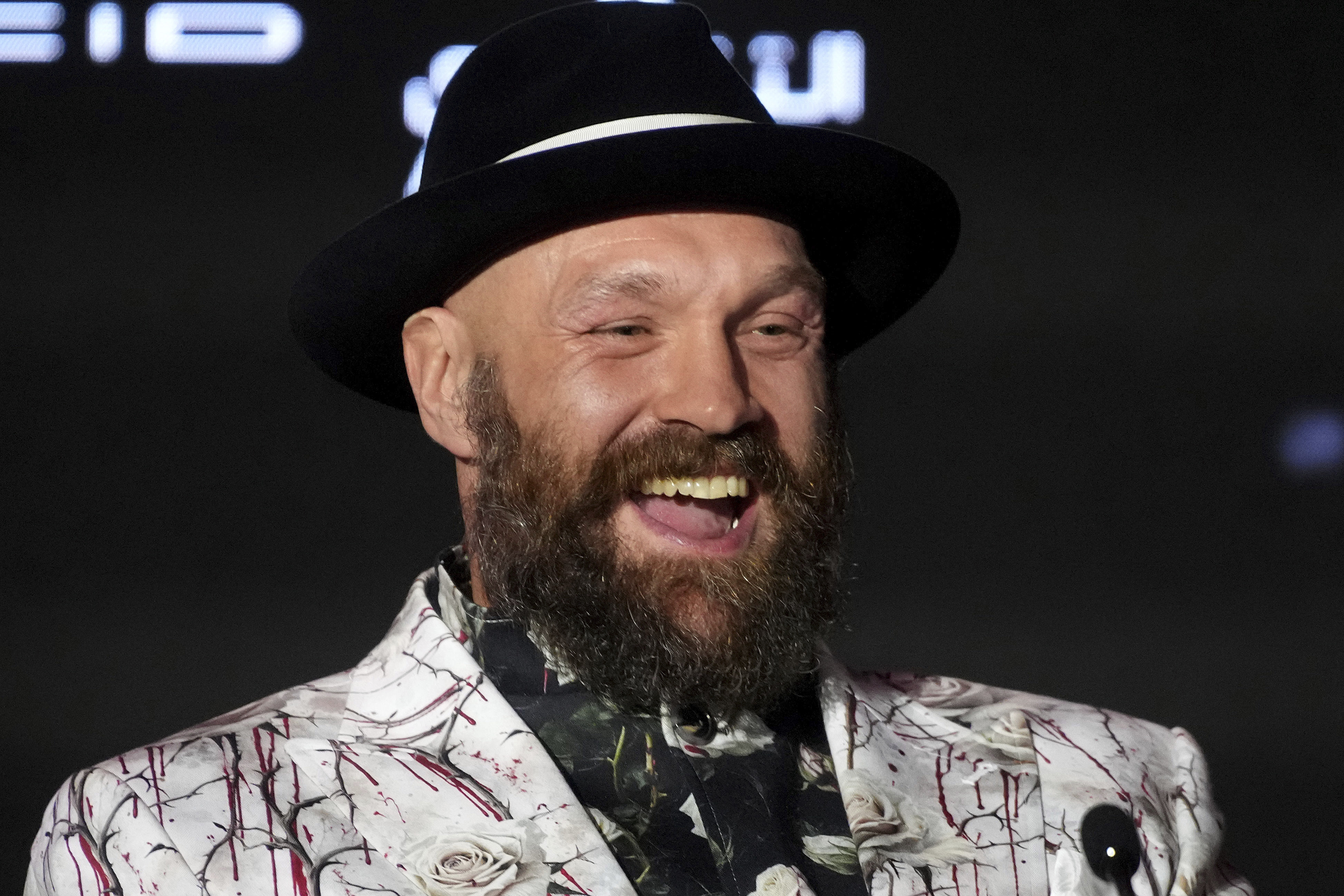 FILE - Boxer Tyson Fury speaks during a press conference in Riyadh, Saudi Arabia, Thursday, Dec. 19, 2024 ahead of the WBA, WBO, and WBC heavyweight title bout between Britain's Tyson Fury and Ukraine's Oleksandr Usyk.
