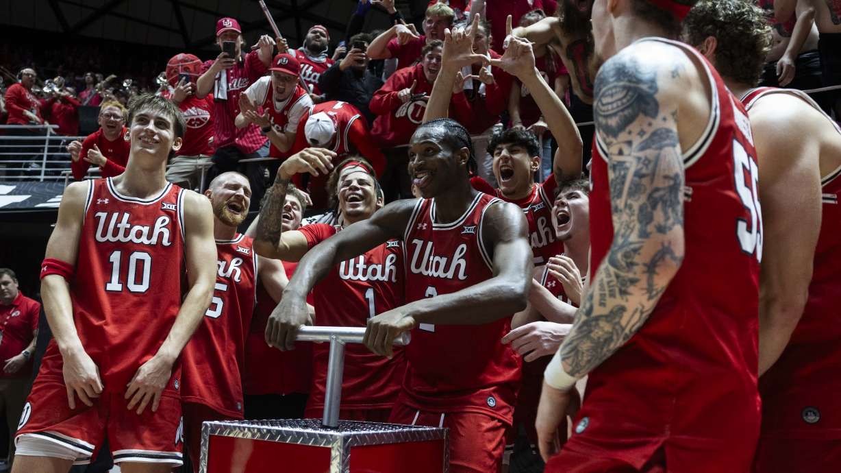 Utah Utes players celebrate after their victory over the Brigham Young Cougars after a basketball game at the Jon M. Huntsman Center on the campus of the University of Utah in Salt Lake City on Saturday, Jan. 18, 2025.