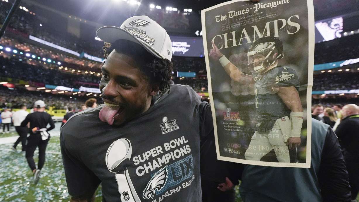 Philadelphia Eagles safety C.J. Gardner-Johnson holds a newspaper after an Eagles win over the Kansas City Chiefs in the NFL Super Bowl 59 football game, Sunday, Feb. 9, 2025, in New Orleans.