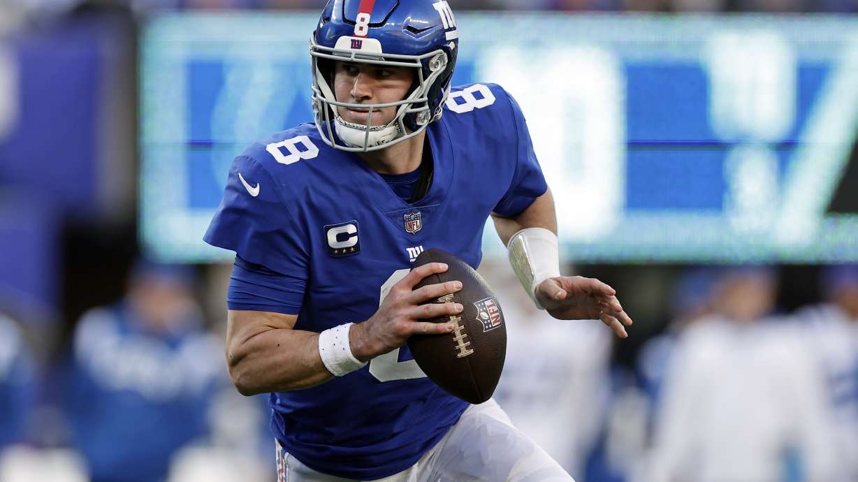 FILE - New York Giants quarterback Daniel Jones runs with the ball against the Indianapolis Colts during an NFL football game, Jan. 1, 2023, in East Rutherford, N.J.