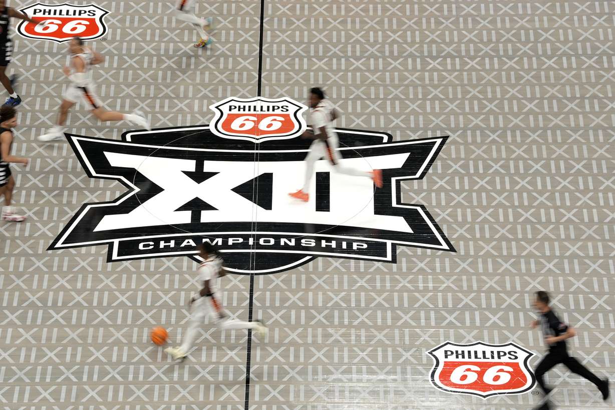 The Big 12 logo is seen on the court during the second half of an NCAA college basketball game between Cincinnati and Oklahoma State in the first round of the Big 12 Conference tournament, Tuesday, March 11, 2025, in Kansas City, Mo.