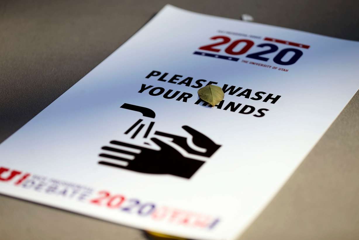 A flyer urging people to wash their hands is pictured on a table on Thursday, Oct. 8, 2020, the day after the vice presidential debate at the University of Utah in Salt Lake City.