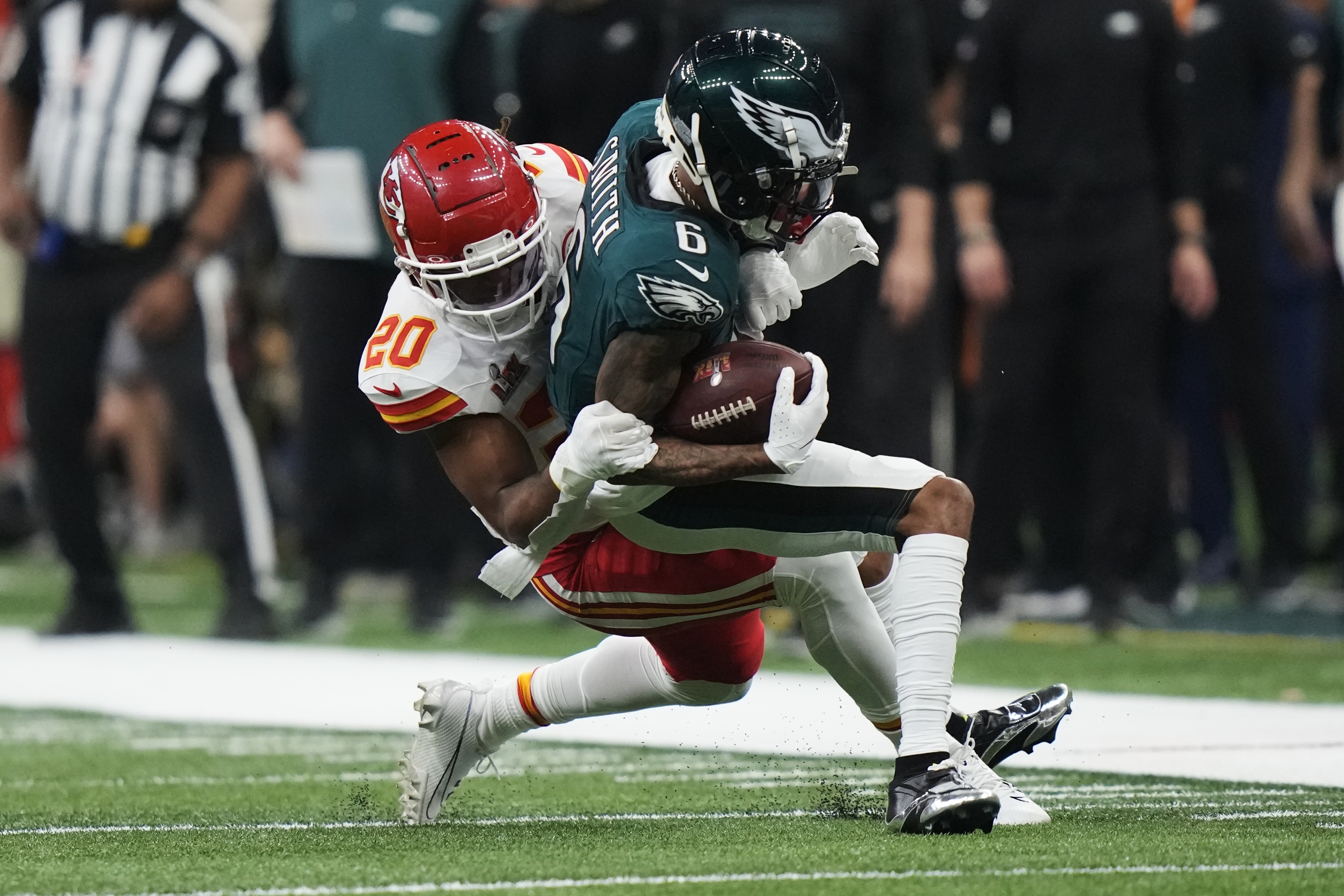 Philadelphia Eagles wide receiver DeVonta Smith (6) is hit by Kansas City Chiefs safety Justin Reid (20) during the second half of the NFL Super Bowl 59 football game, Sunday, Feb. 9, 2025, in New Orleans. 