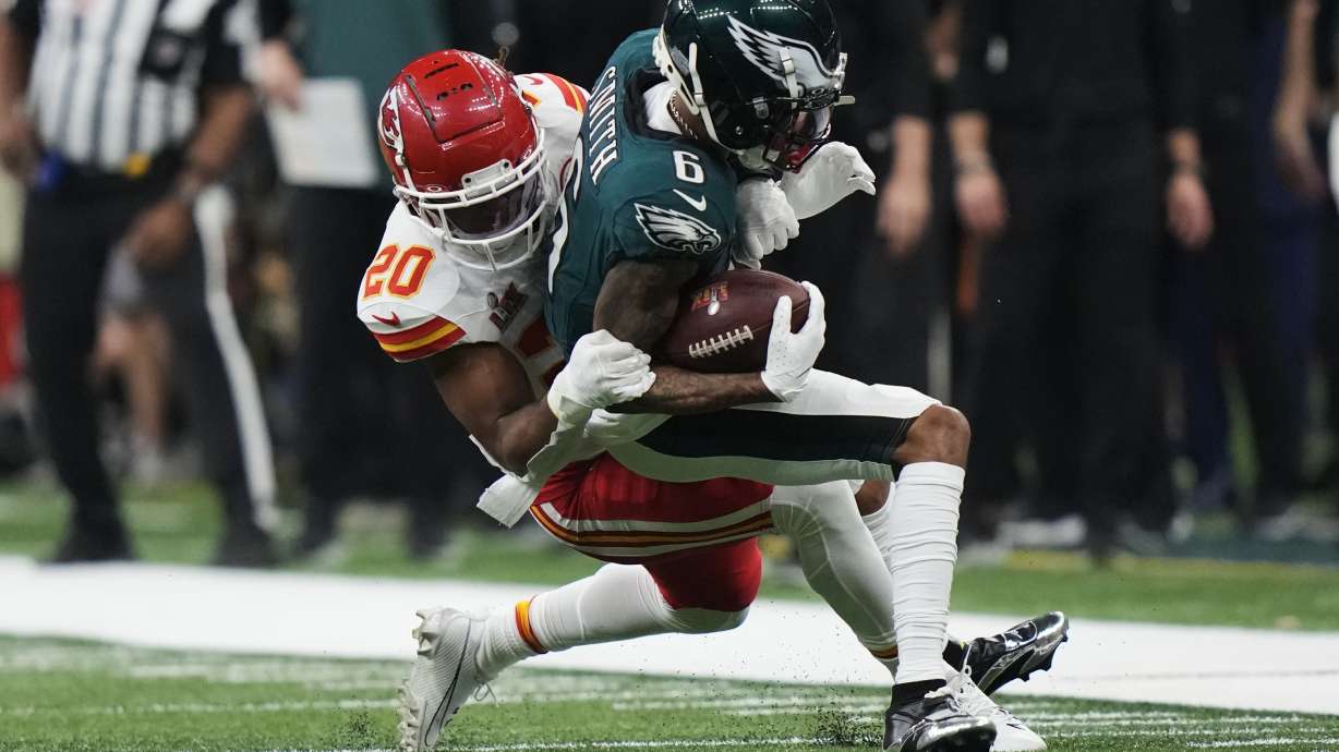 Philadelphia Eagles wide receiver DeVonta Smith (6) is hit by Kansas City Chiefs safety Justin Reid (20) during the second half of the NFL Super Bowl 59 football game, Sunday, Feb. 9, 2025, in New Orleans.