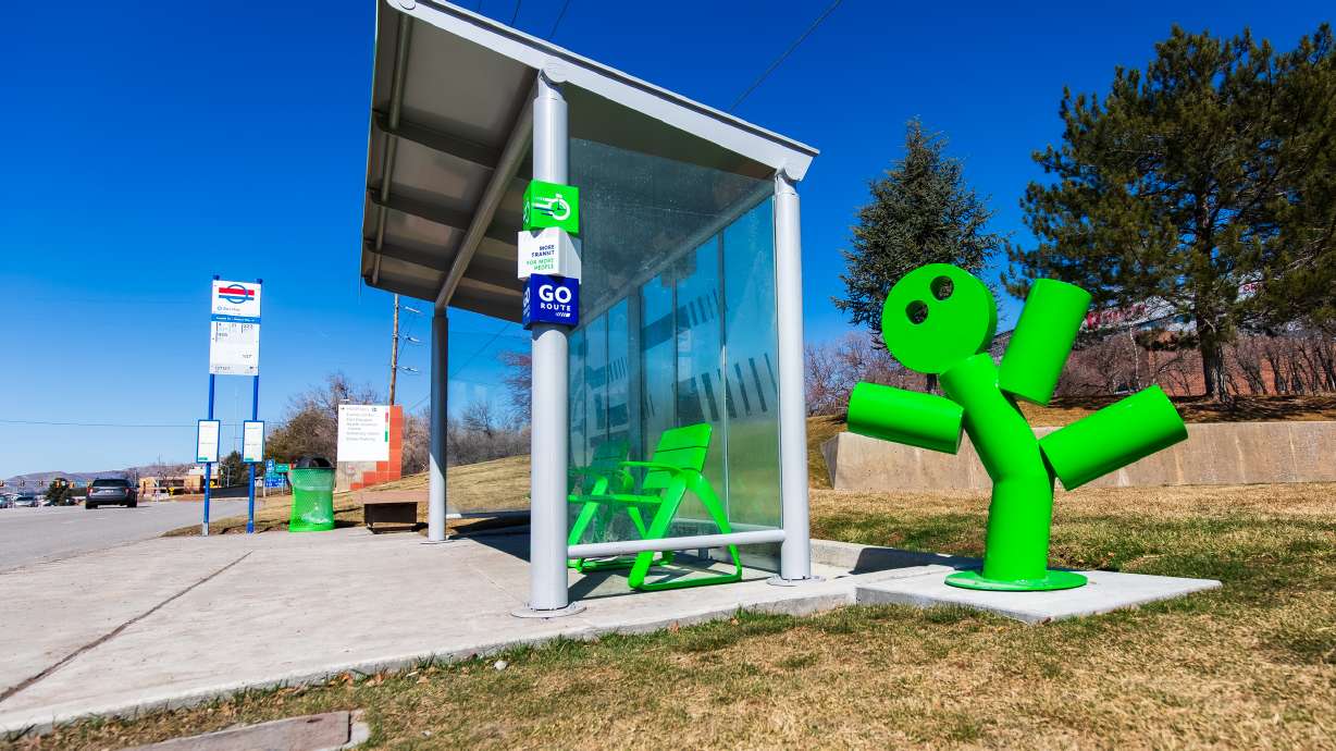 A "Go Route" bus stop is pictured by Foothill Drive and Wakara Way in Salt Lake City on Sunday. The stop's green scheme aims to highlight Route 21's 15-minute service.