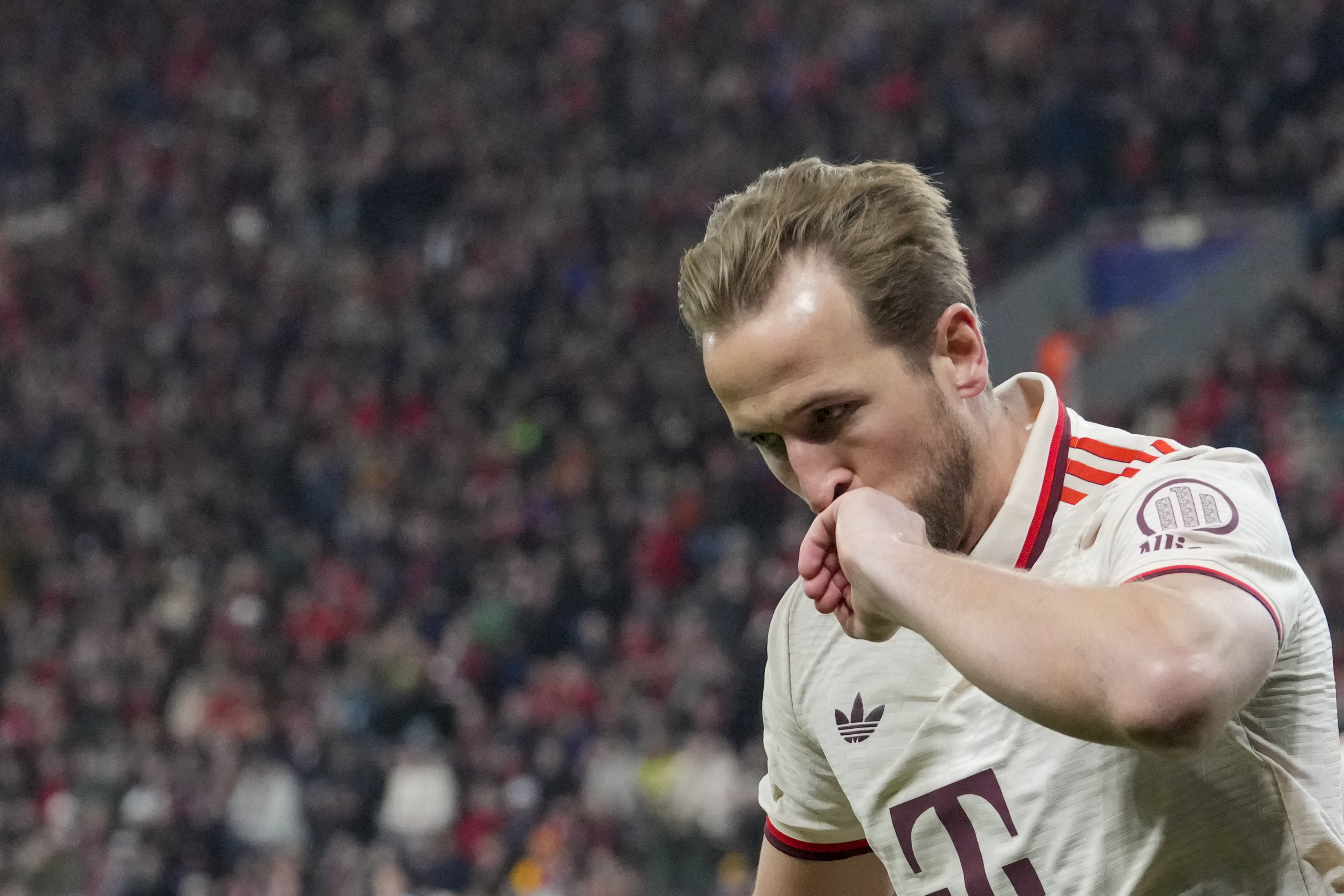 Bayern's Harry Kane celebrates after scoring the opening goal during the Champions League round of 16 second leg soccer match between Bayer Leverkusen and Bayern Munich at the BayArena in Leverkusen, Germany, Tuesday, March 11, 2025.