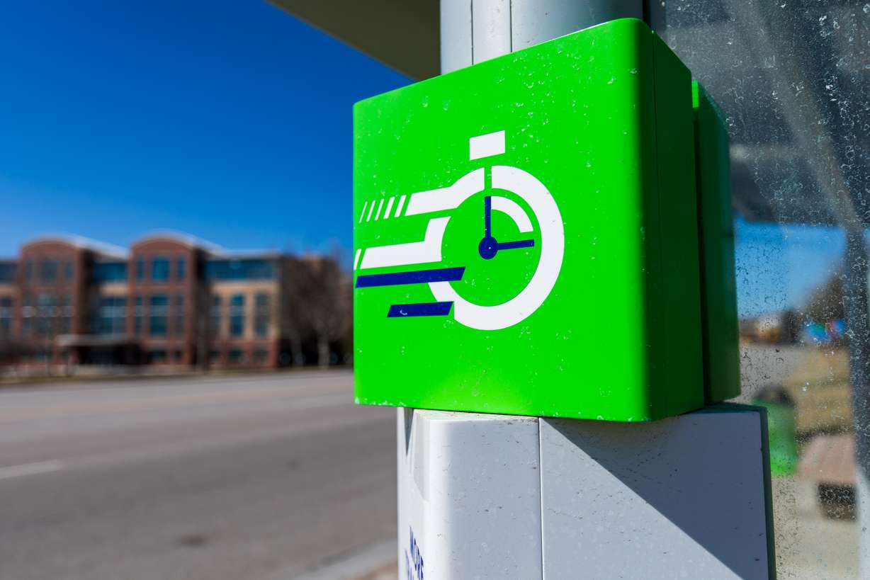 A "Go Route" bus stop is pictured by Foothill Drive and Wakara Way in Salt Lake City on Sunday. The stop's green scheme aims to highlight Route 21's 15-minute service.