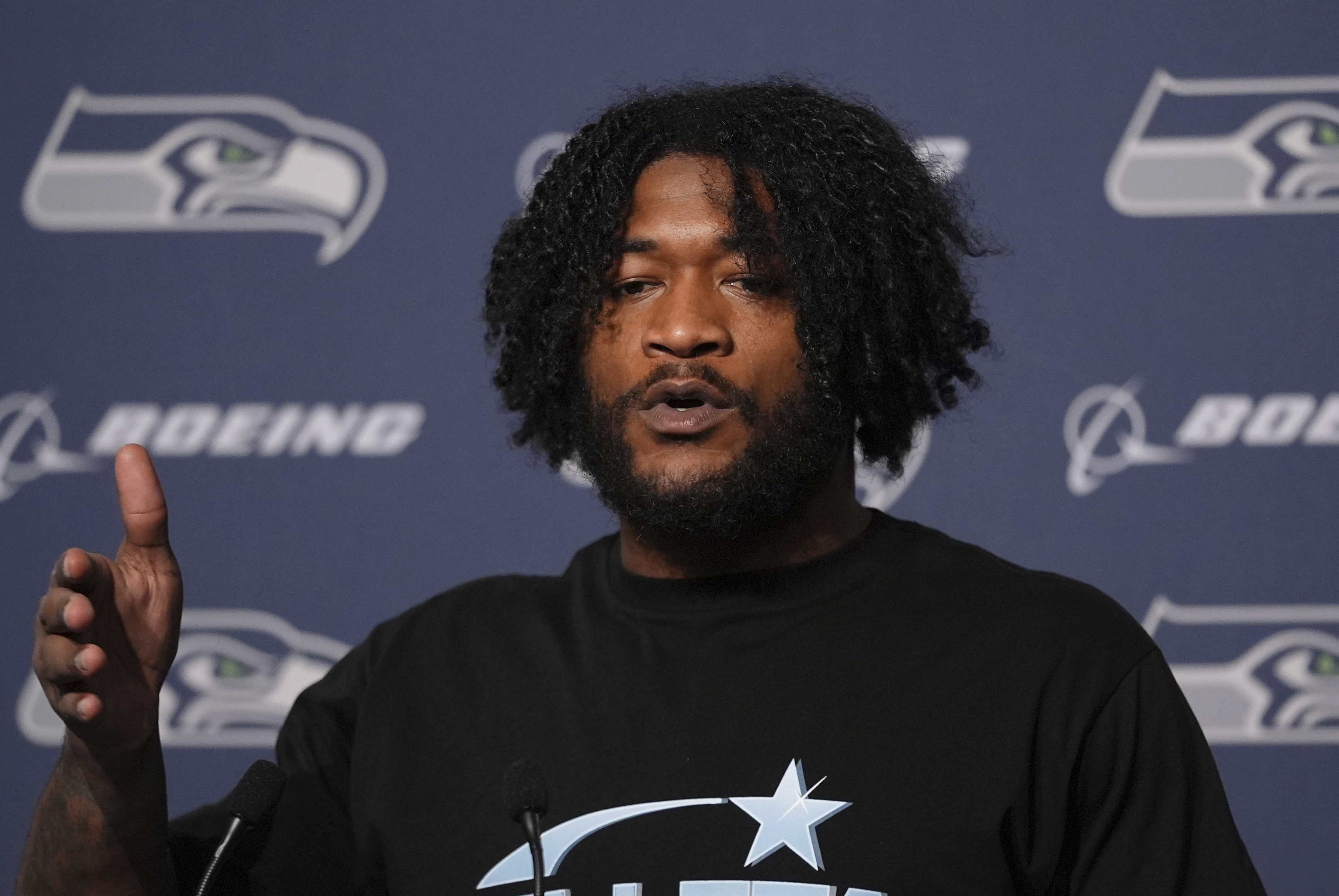 FILE - Seattle Seahawks linebacker Ernest Jones IV (13) answers questions during a press conference after an NFL football game against the Minnesota Vikings, Sunday, Dec. 22, 2024, in Seattle.
