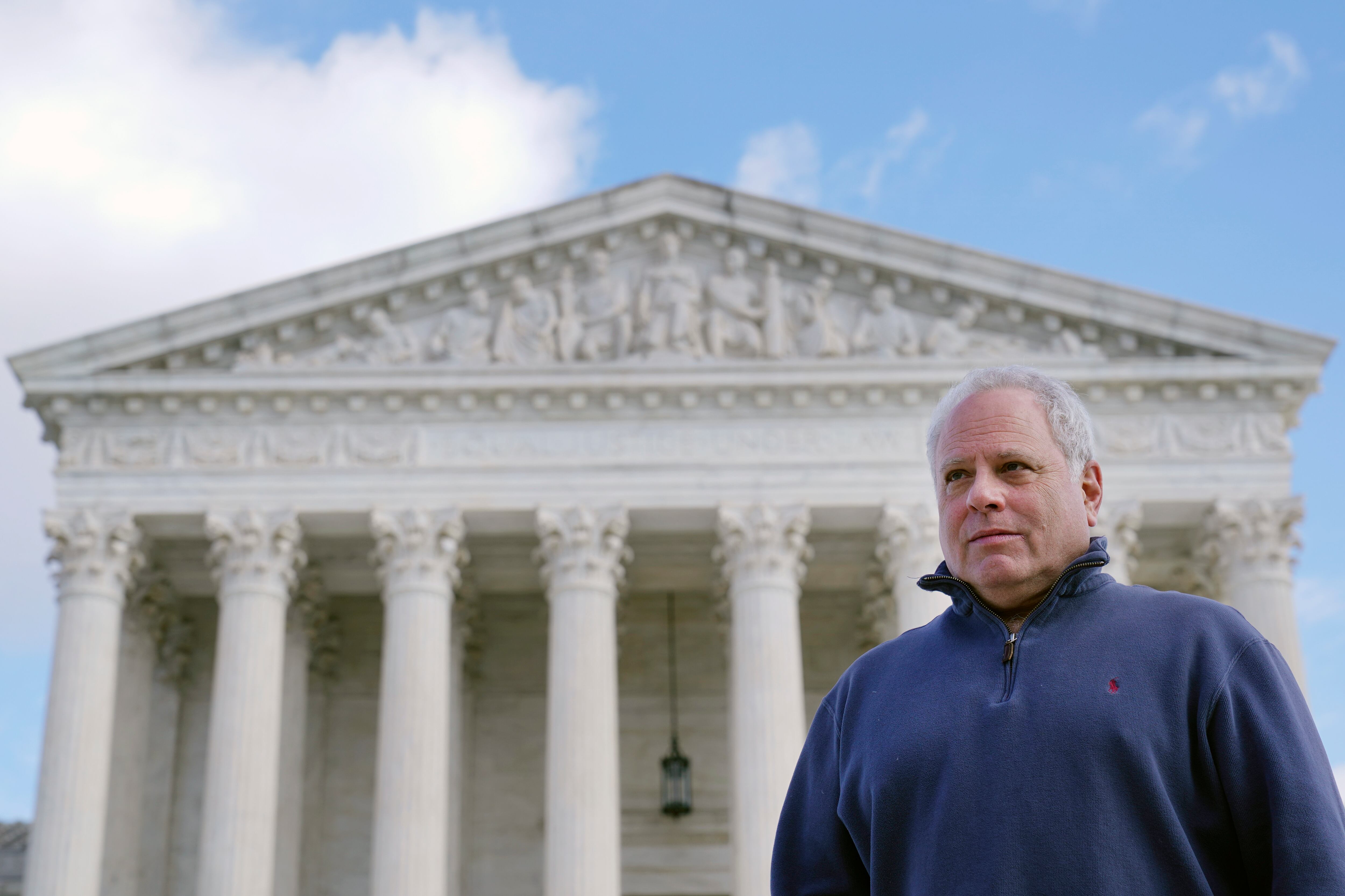 David Cassirer, the great-grandson of Lilly Cassirer, poses for a photo outside the Supreme Court in Washington, Jan. 18, 2022. Lilly Cassirer surrendered her family's priceless Camille Pissarro painting to the Nazis in exchange for safe passage out of Germany during the Holocaust. The Supreme Court is hearing the case about the stolen artwork now in the collection of a Spanish museum in Madrid.