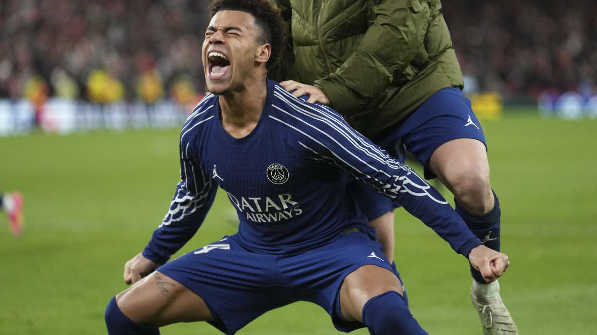 PSG's Desire Doue celebrates after the Champions League round of 16 second leg soccer match between Liverpool and Paris Saint-Germain at Anfield in Liverpool, England, Tuesday, March 11, 2025.