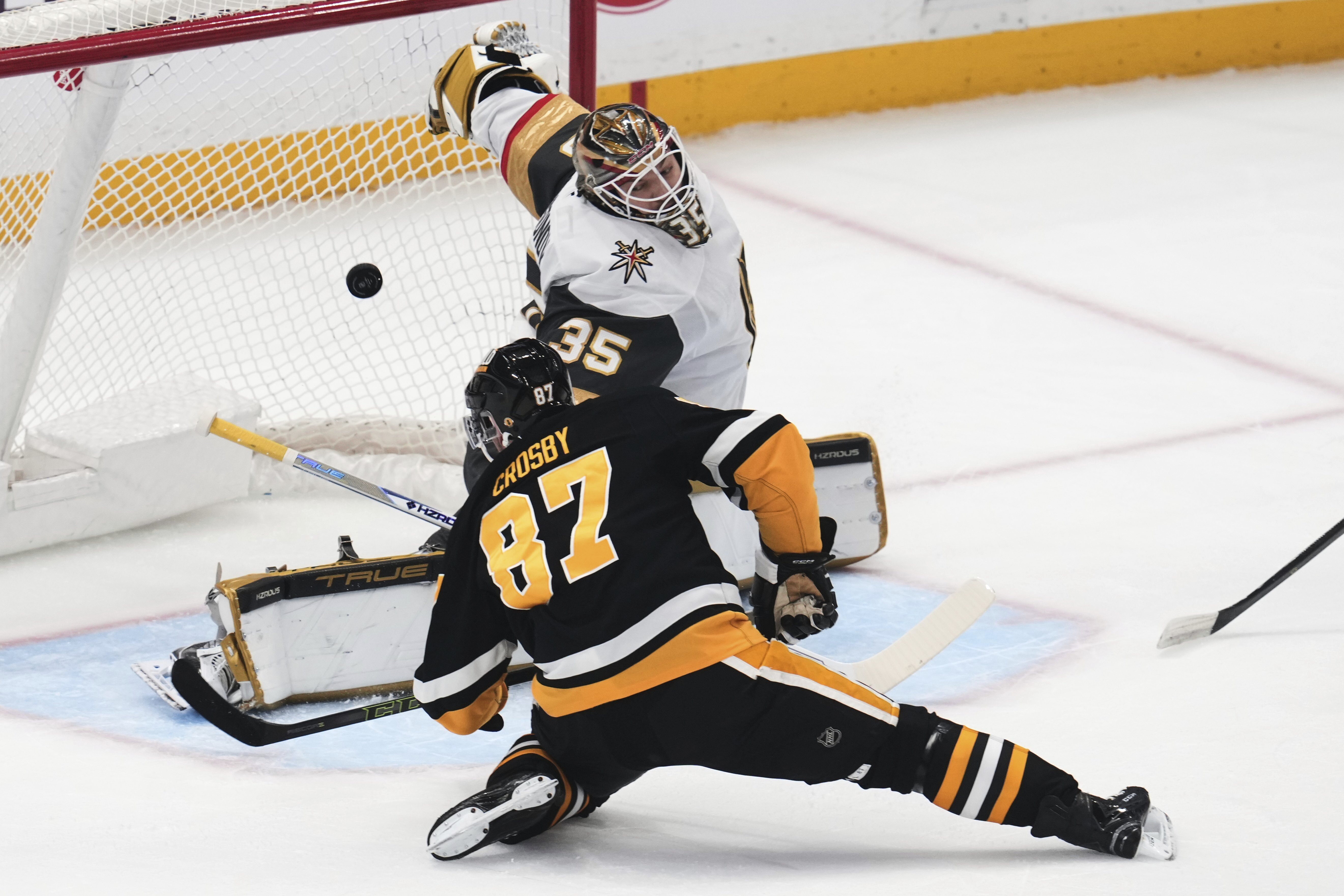 Pittsburgh Penguins' Sidney Crosby (87) gets a shot behind Vegas Golden Knights goaltender Ilya Samsonov (35) for a goal during the first period of an NHL hockey game in Pittsburgh, Tuesday, March 11, 2025.