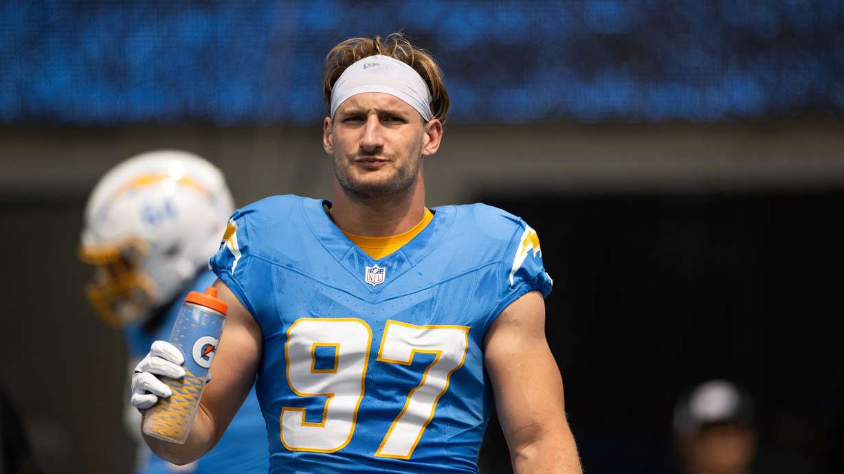 FILE - Los Angeles Chargers linebacker Joey Bosa (97) drinks water before an NFL football game against the Las Vegas Raiders, Sept. 8, 2024, in Inglewood, Calif.