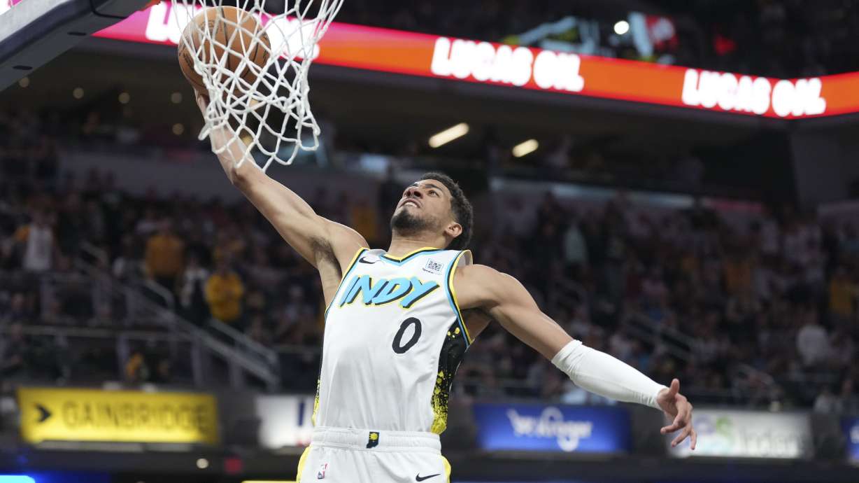 Indiana Pacers guard Tyrese Haliburton (0) dunks while playing the Milwaukee Bucks during the second half of an NBA basketball game in Indianapolis, Tuesday, March 11, 2025.
