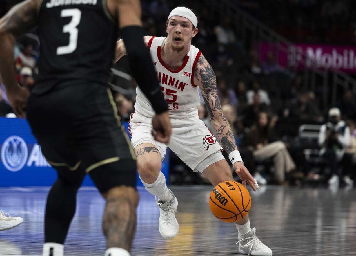 Utah Utes guard Gabe Madsen (55) dribbles the ball down the court during a first round game of the Big 12 Championship between the Utah Utes and the UCF Knights at the T-Mobile Center in Kansas City, Missouri, on Tuesday, March 11, 2025.