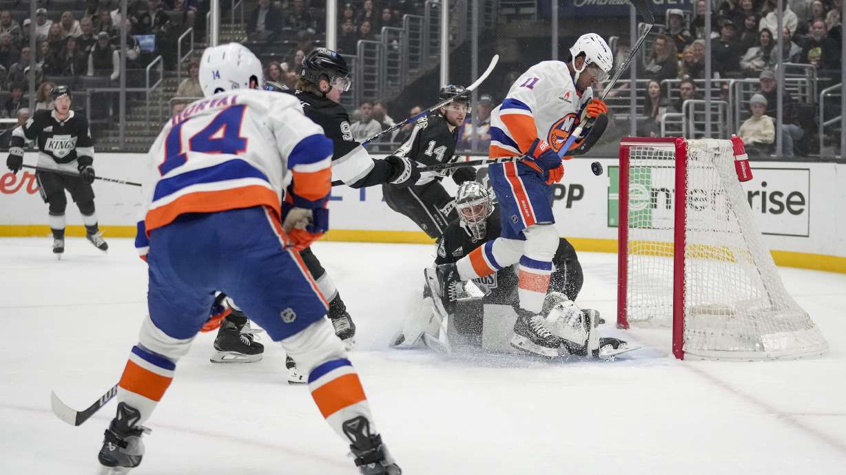 New York Islanders left wing Anthony Duclair (11) shoots against Los Angeles Kings goaltender Darcy Kuemper (35) during the first period of an NHL hockey game Tuesday, March 11, 2025, in Los Angeles.