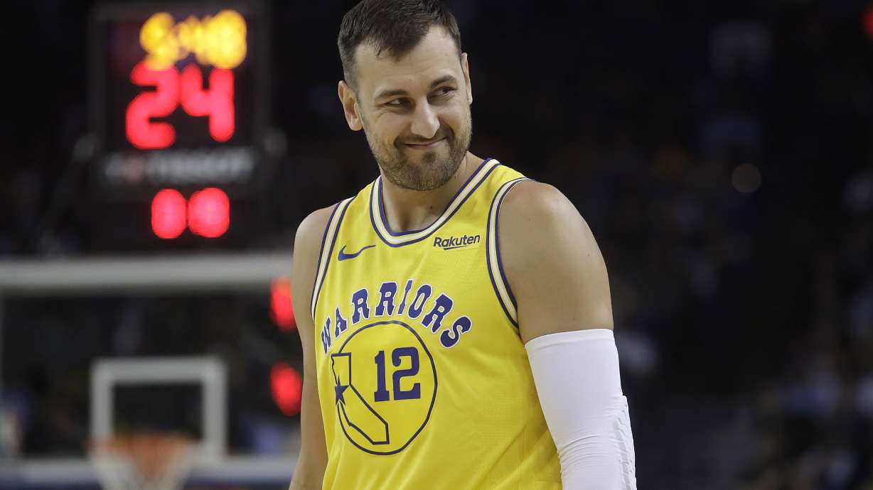 FILE - In this Tuesday, April 2, 2019 file photo, Golden State Warriors center Andrew Bogut looks on during an NBA basketball game against the Denver Nuggets in Oakland, Calif..